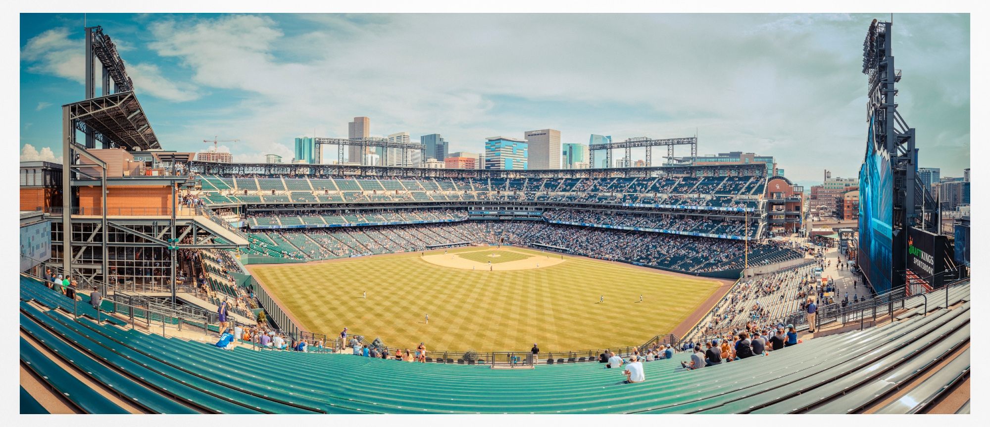 100megapixel panorama of Coors Field on a sweltering 41°C day in Denver, Colorado.  Pale green, blues & muted orange colours. This image takes in almost the entire baseball field, with the field in the middle.  Replicating Kodak Ektachrome look, with film grain .