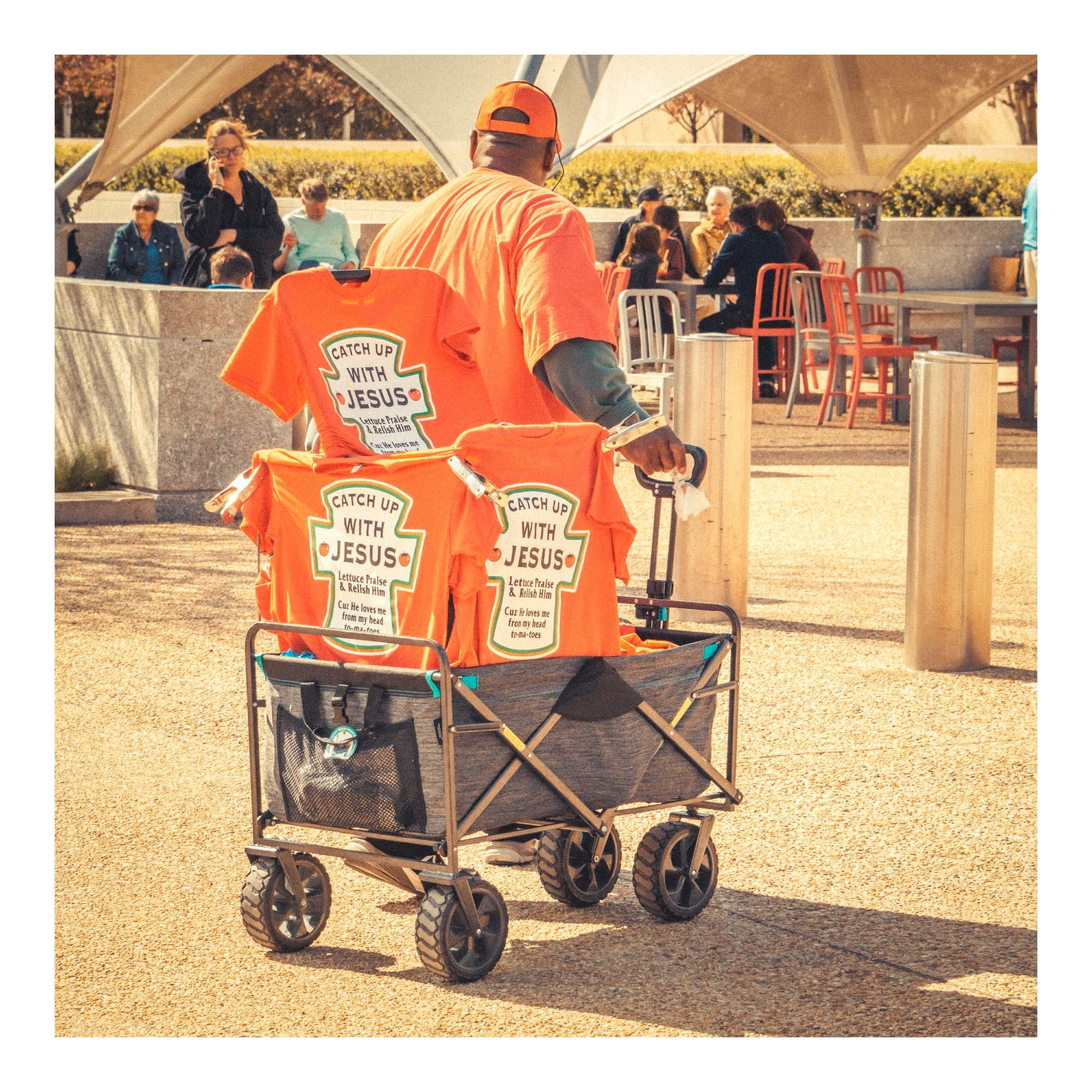 A guy selling 'Catch up with Jesus' t-shirts, using the iconic Heinz Ketchup label