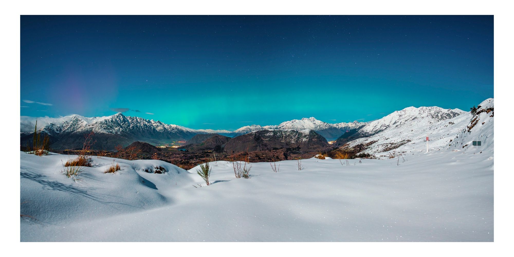 Aurora over the Queenstown valley with lots of fresh new snow