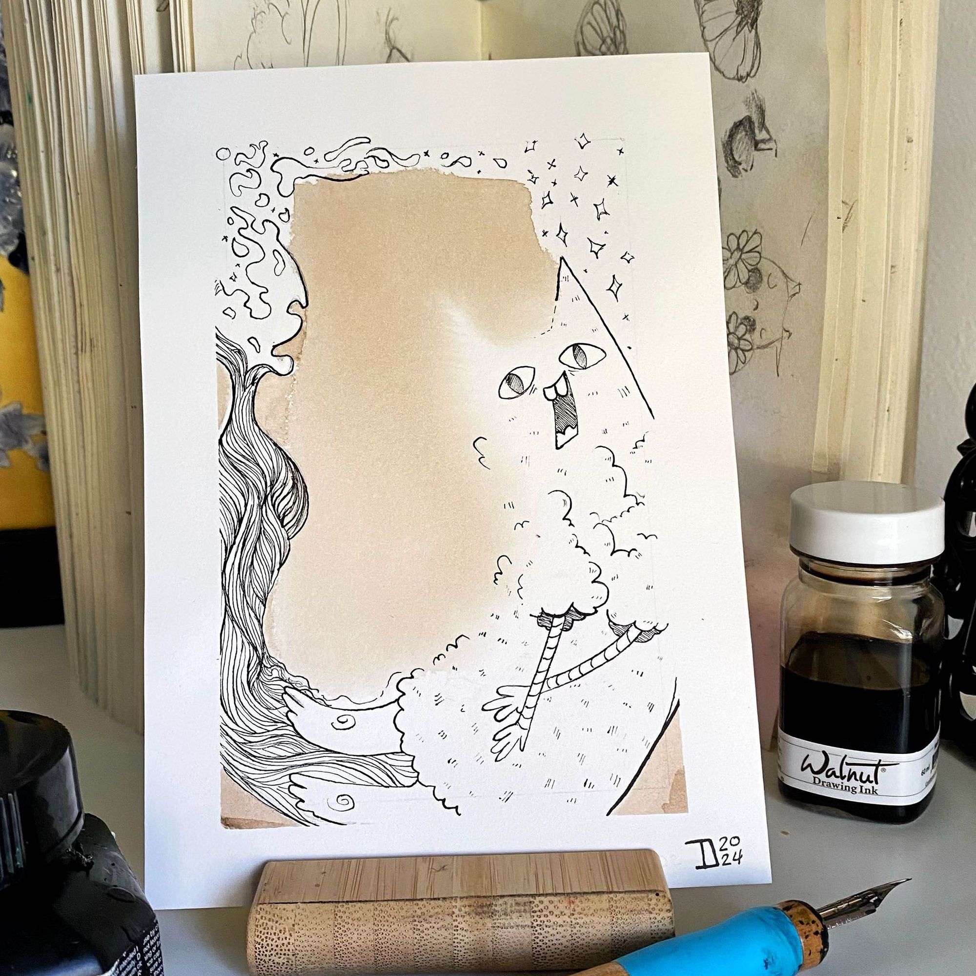 Photography of ink illustration with cryptid figure made of a cat and bird. 