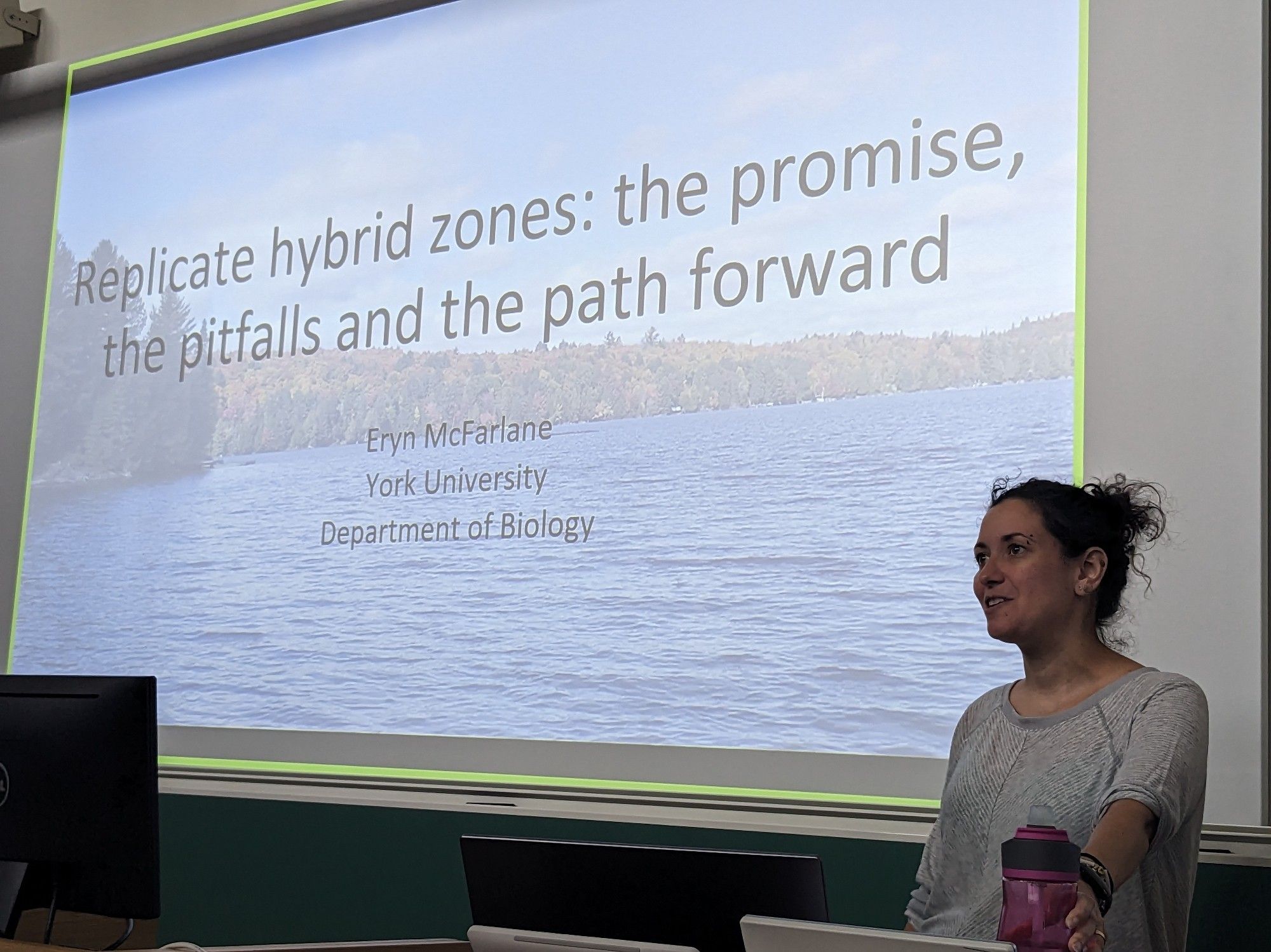 Eryn McFarlane in front of her title slide that reads: replicate hybrid zones: the promise, the pitfalls and the path forward