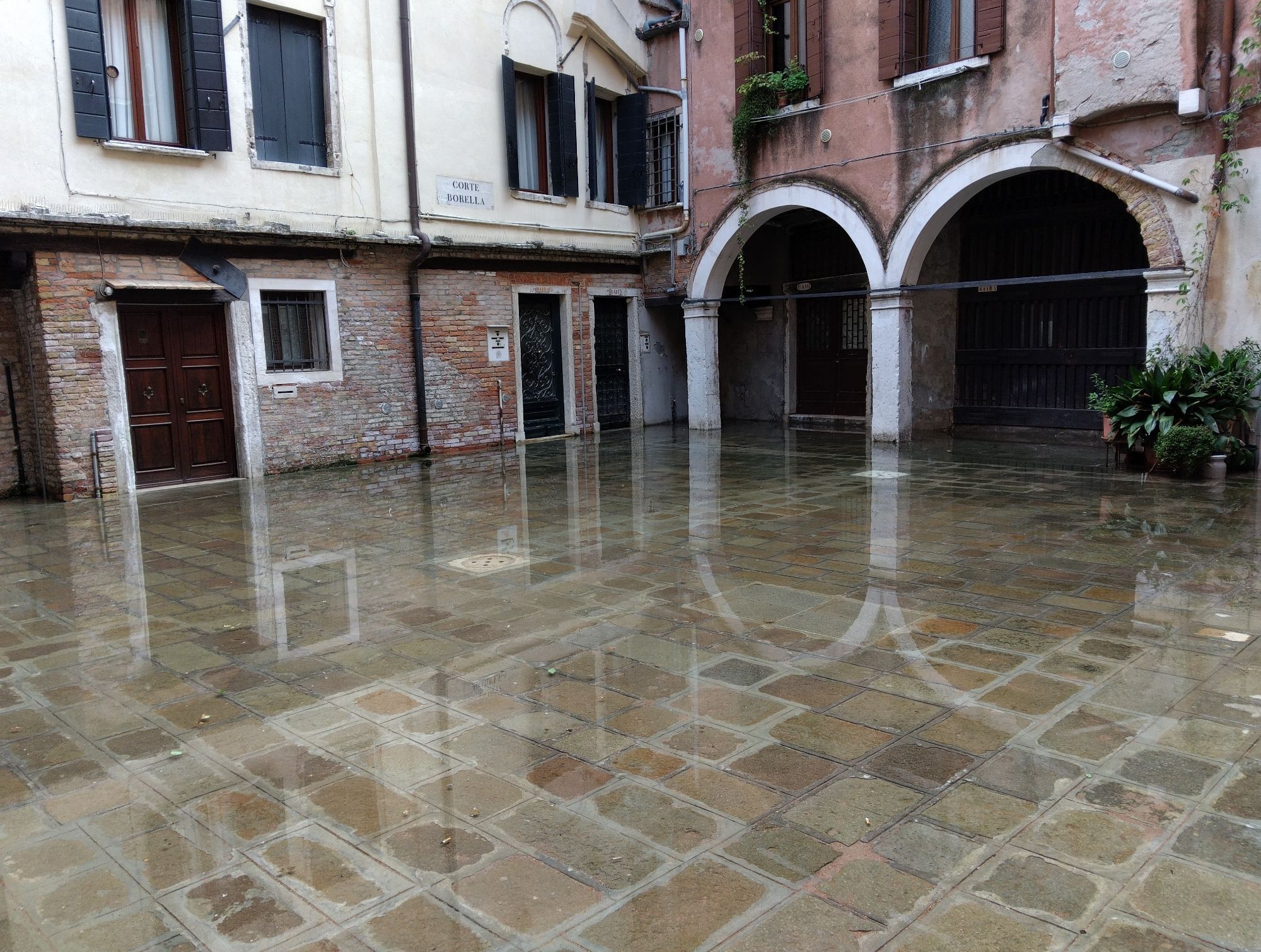 A Venetian courtyard entirely under water.