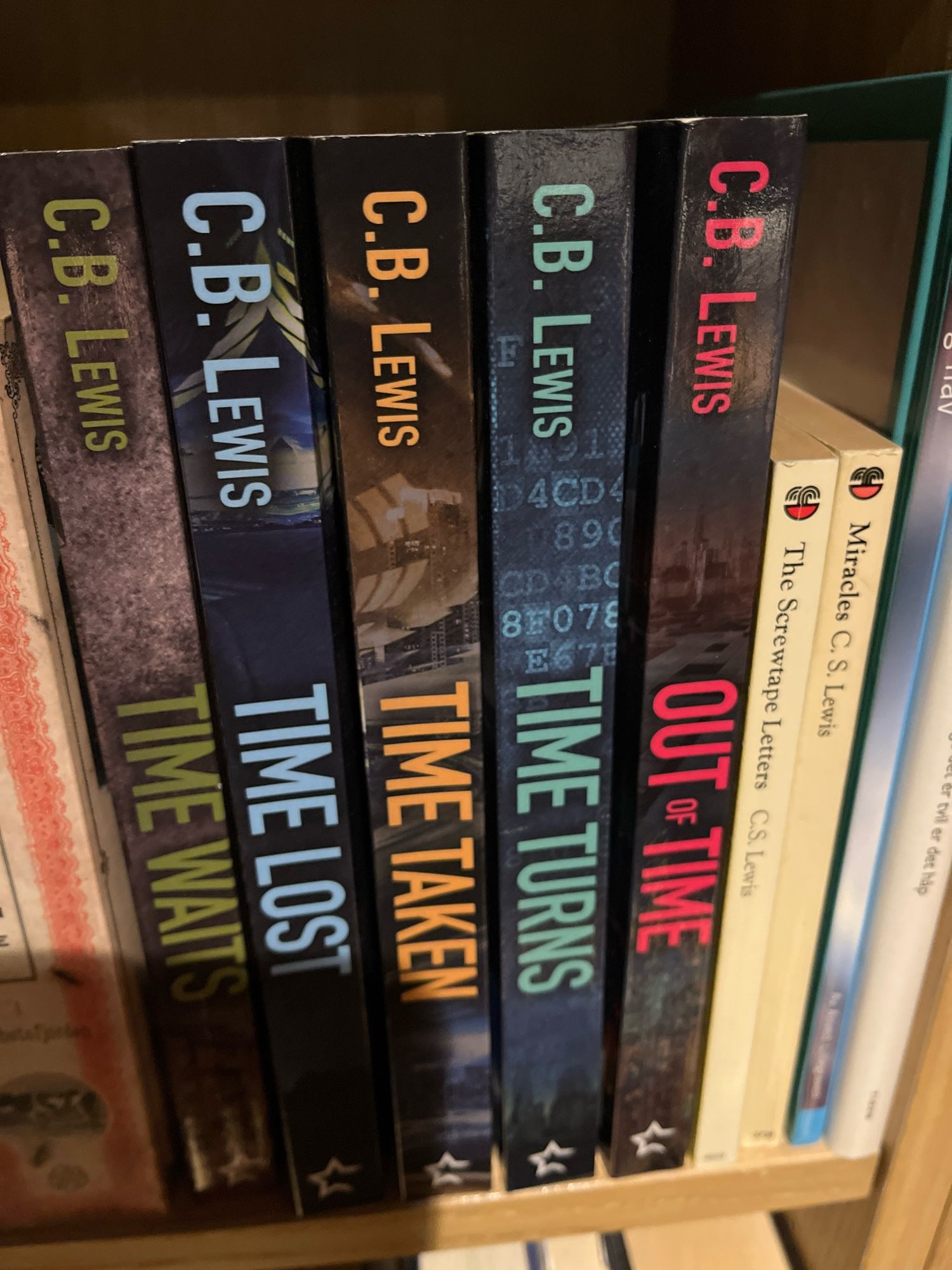 Five CB Lewis books in my bookshelf, next to two by CS Lewis

