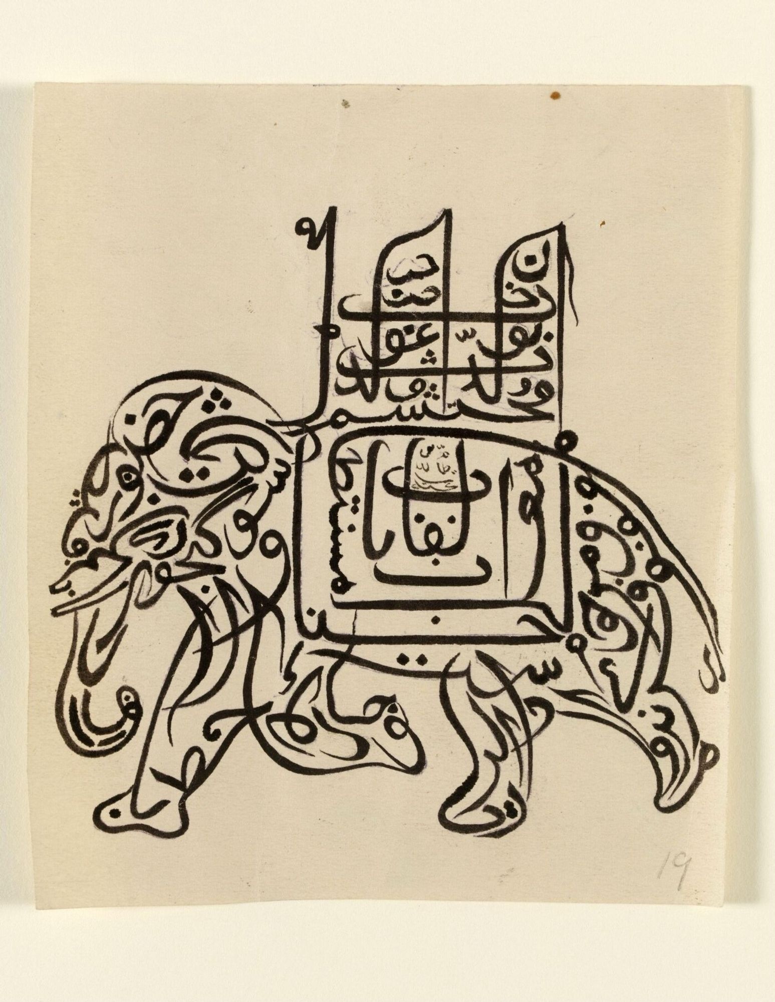 “Drawing, in black ink on paper, ornamental calligraphy in the form of a running elephant, saddled with a double-seated high saddle. The whole embodies the name and titles of a Nawab of Jasra.
(the name and designation of a Nawab of Jasra)
Transliteration
'Janab Ahtsham-ud-Daula. Muhammed Ismail Khan Sahib Bahadur, Firoz Jung, Valiya Shahr Gulahan urf Jasra, Dam-i-Iqbal hum'”
“See letter of Hendley to Caspar Purdon Clarke, December 31 1915 on NFMA/1/H1596, Hendley Family, where he notes that these were from 'the bazaar' and are the originals of those published by him and Chaubey Bisvesvar Nath of Jaipur in the Journal of Indian Art. Several of the calligraphic birds and animals reproduced in the Journal are signed and give their place of origin as Lahore, or the Lahore bazaar.”