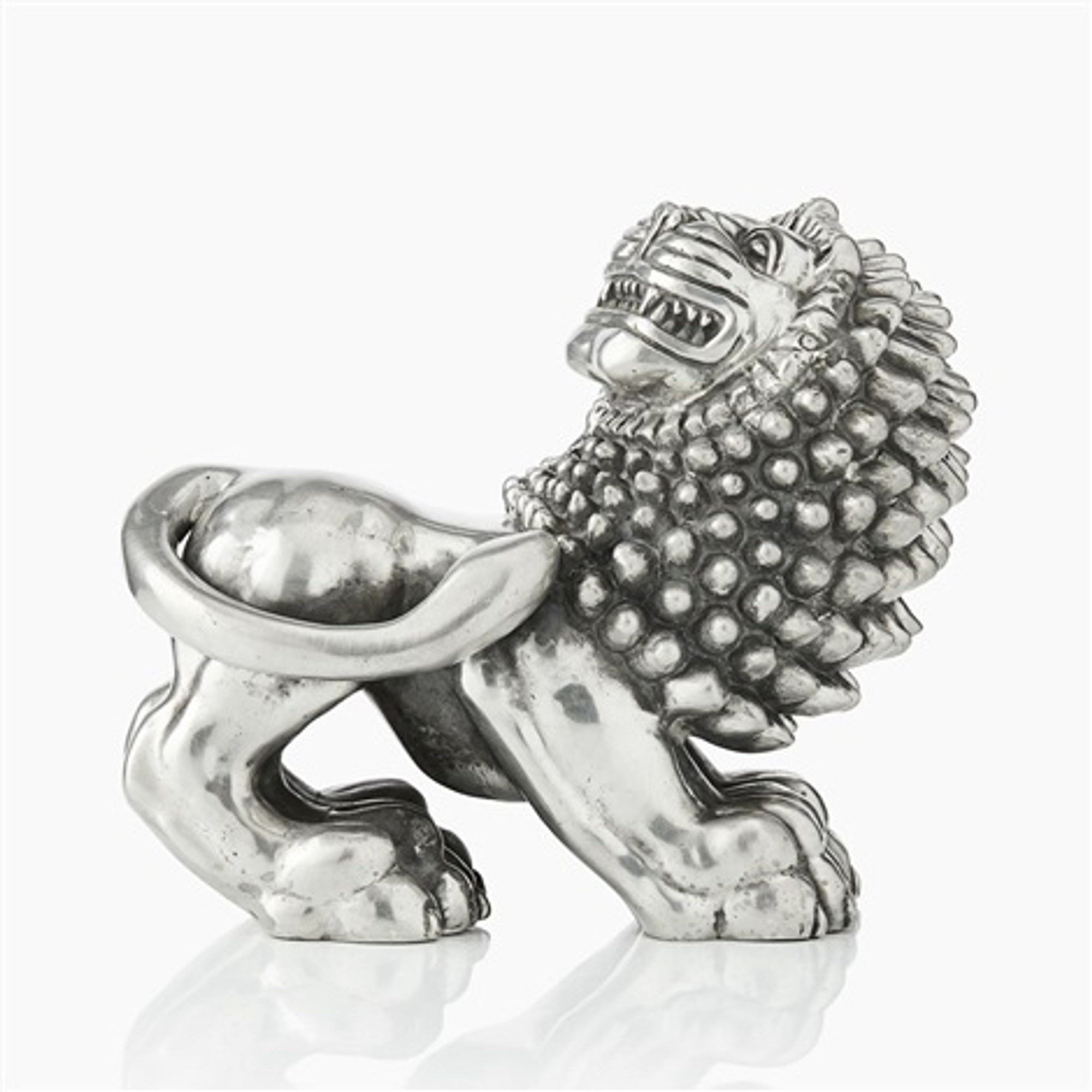 official auction photo of the pewter lion, side profile on white background
“Svenskt Tenn's classic pewter lion was designed in 1926, by Anna Petrus, an artist recognised for her lion sculptures and reliefs created with inspiration from the Far East.” (Info via Svenskt Tenn)