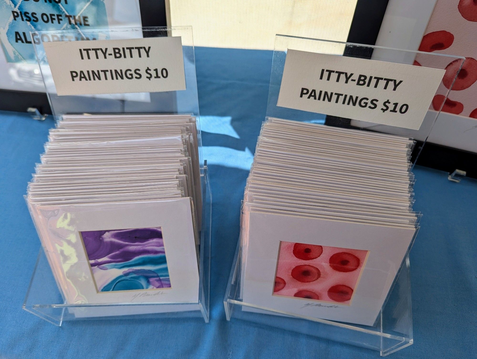 Display boxes of small paintings