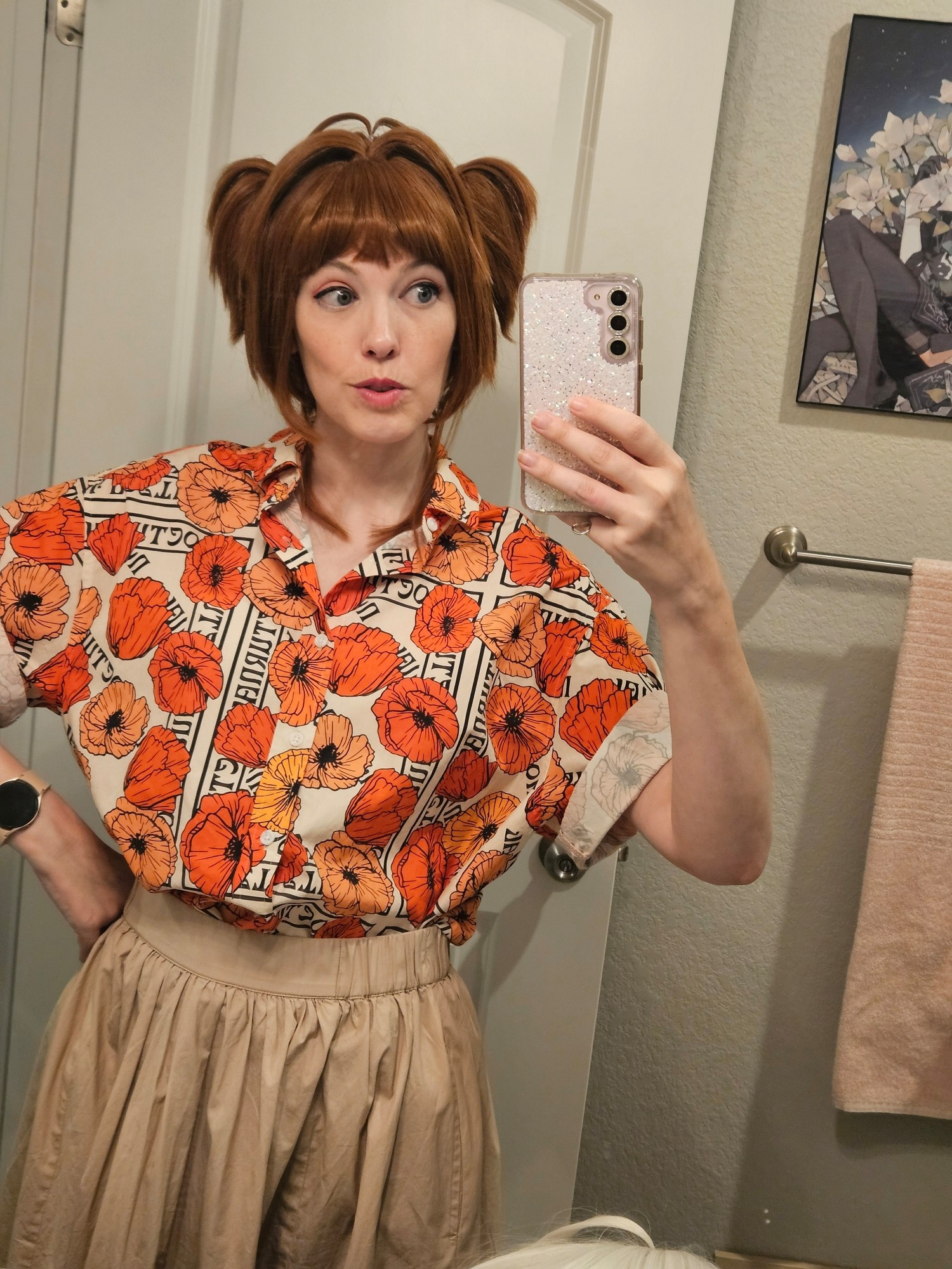 A little non-binary guy taking a mirror selfie and modeling their Cardcaptor Sakura wig.