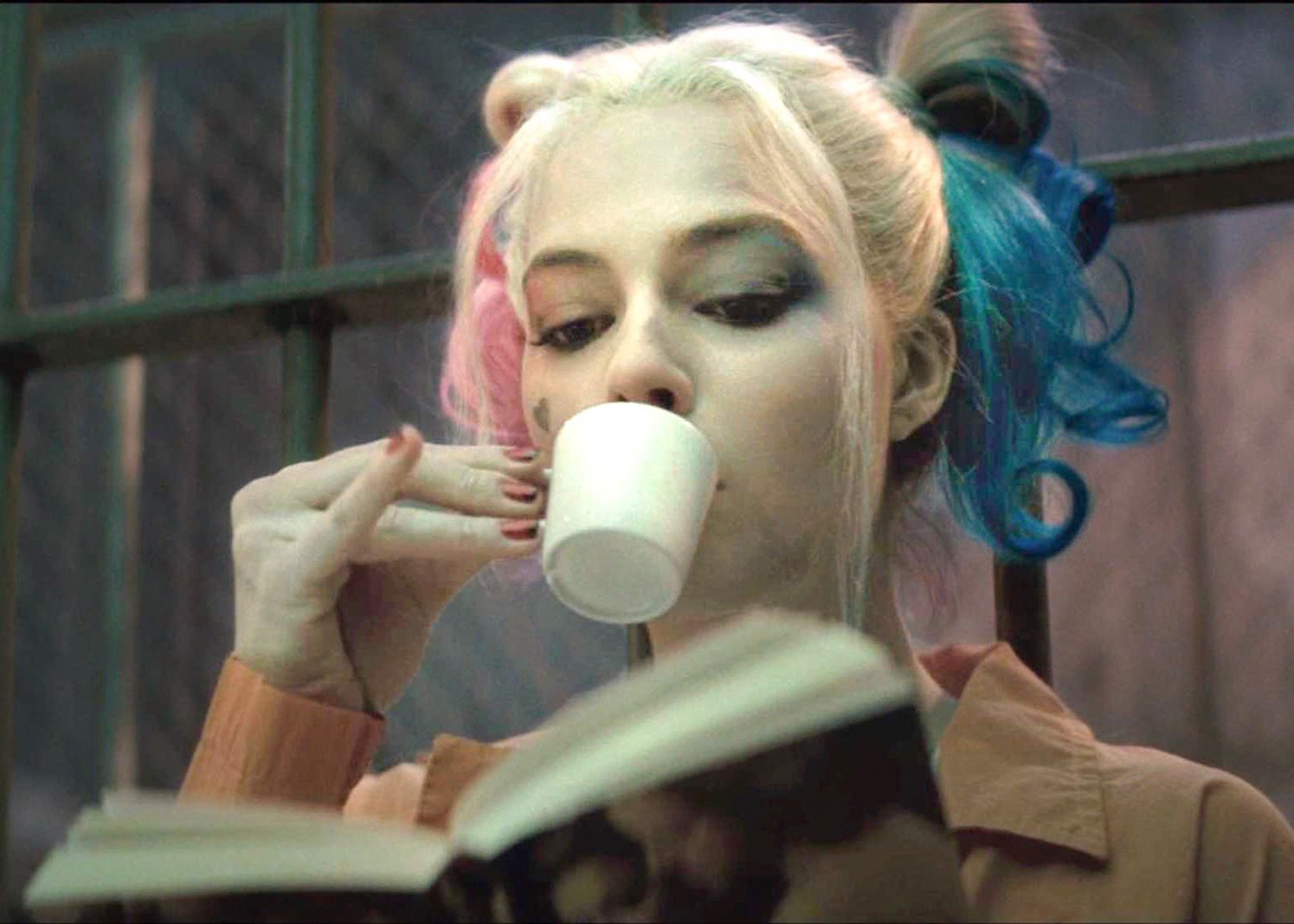 Harley Quinn sipping tea with her pinky up