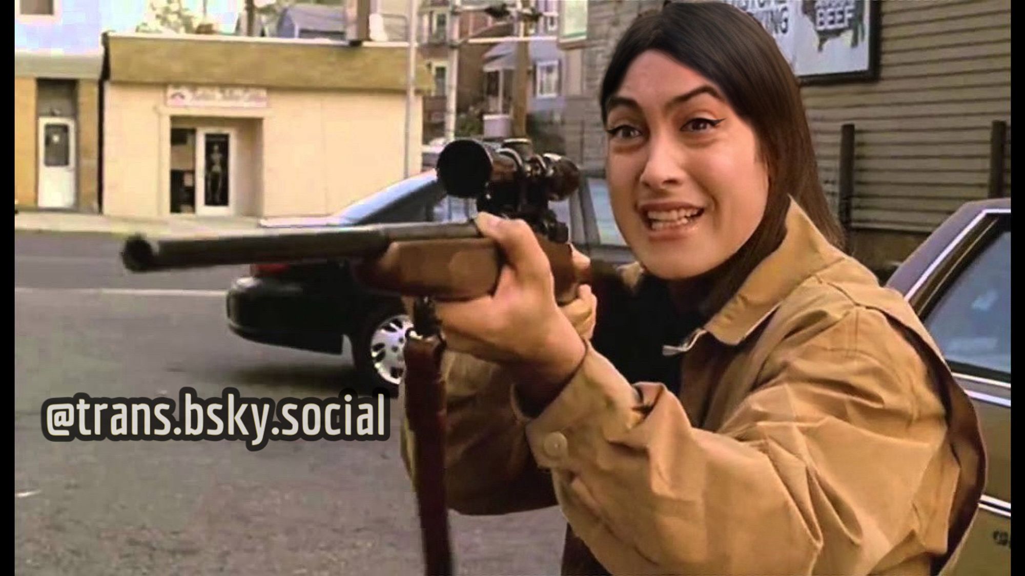 a genderbent version of Artie Bucco (John Ventimiglia) from the sopranos pointing a rifle.