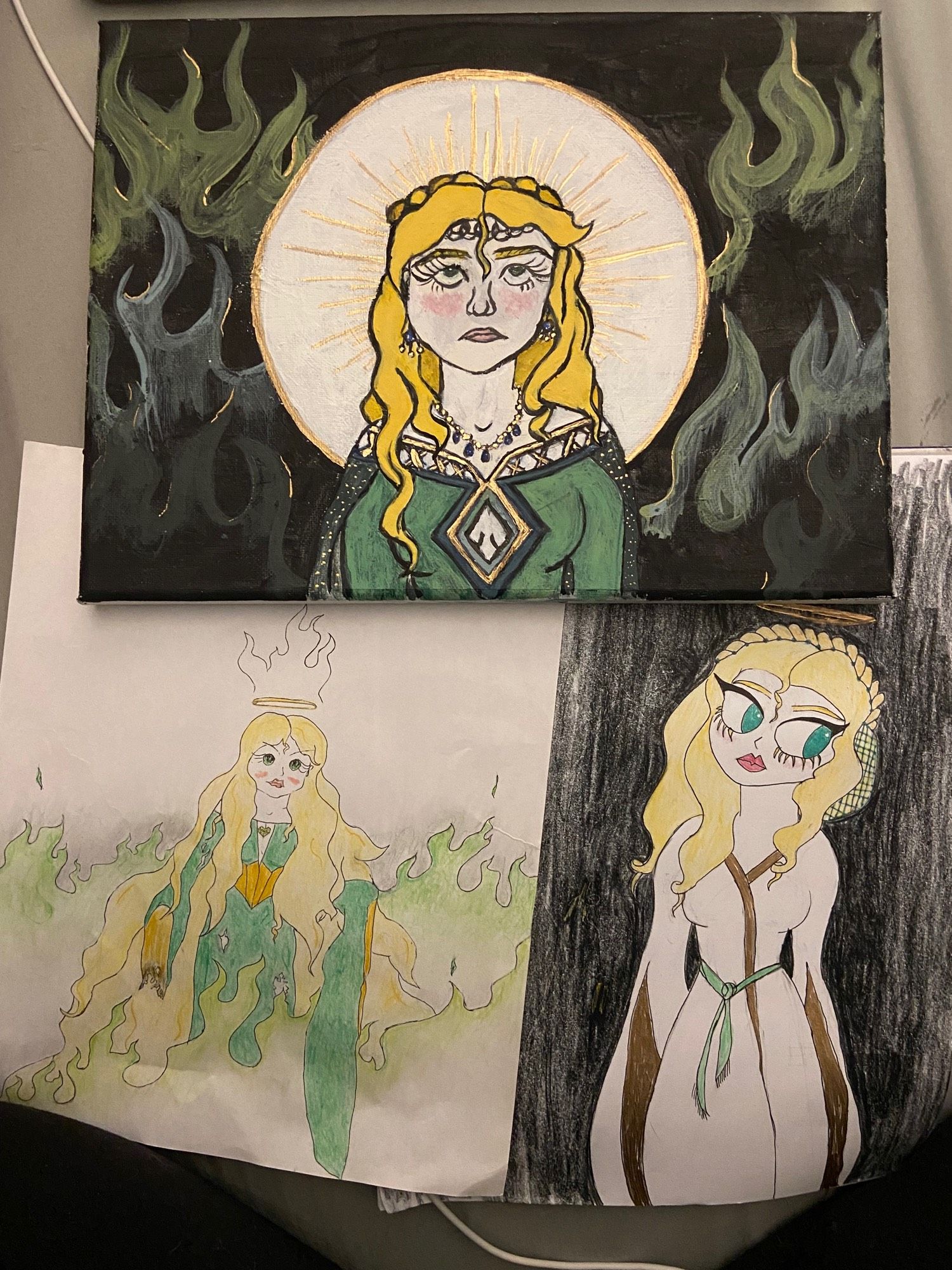 A painting and two drawings of Cersei Lannister. Think art a 13 year old would draw, but if that 13 year old was 26 and is trying their best to make art.

Cersei is shrouded in flames in two pieces and darkness in the other. In all three pictures she has some sort of halo on her head.