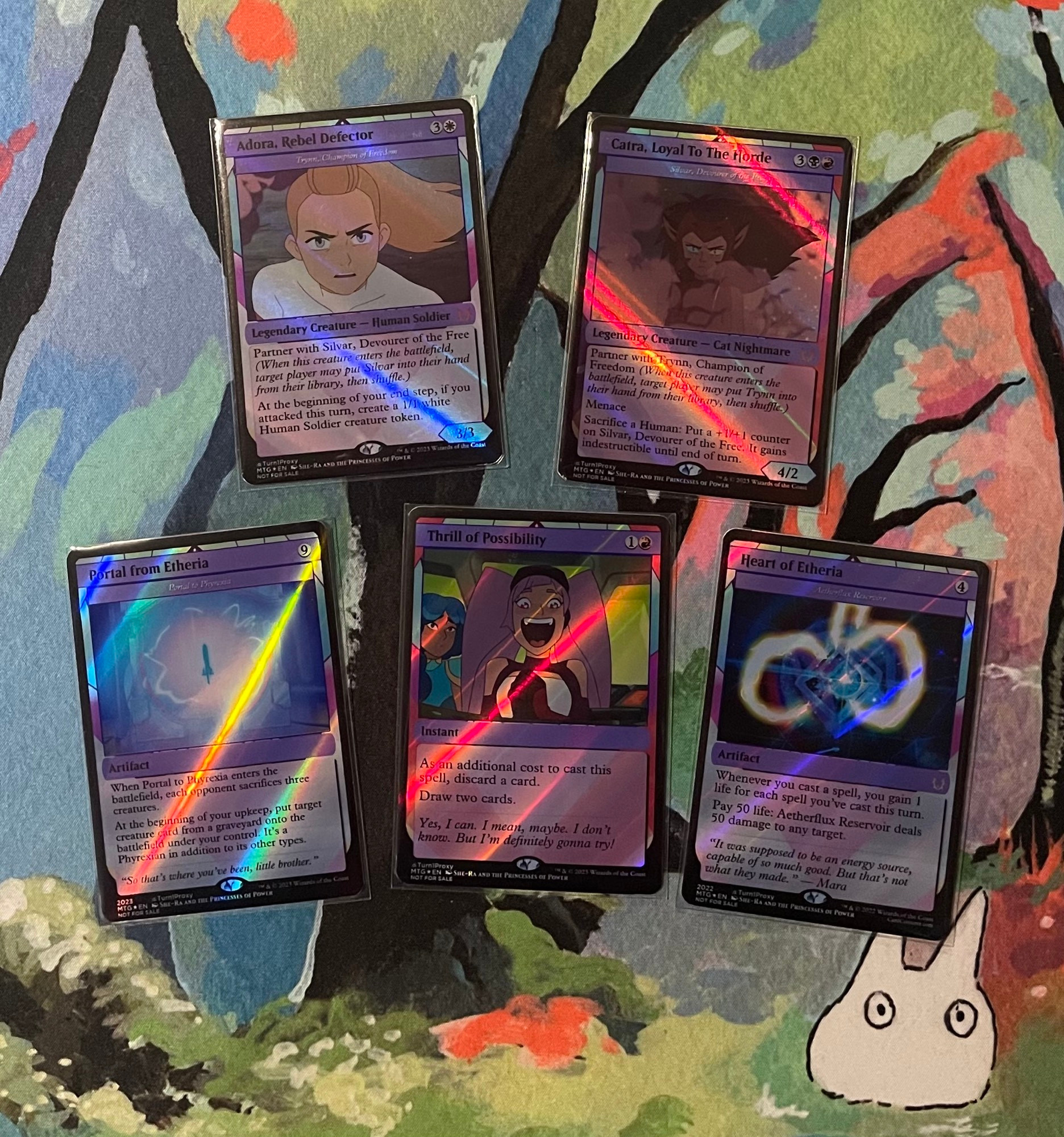 Magic card proxies, Adora as Trynn, Catra as Silvar, Portal from Etheria as Portal to Phyrexia, Trill of Possibility with Entrapta, and Heart of Etheria as Aetherflux Reservoir. 