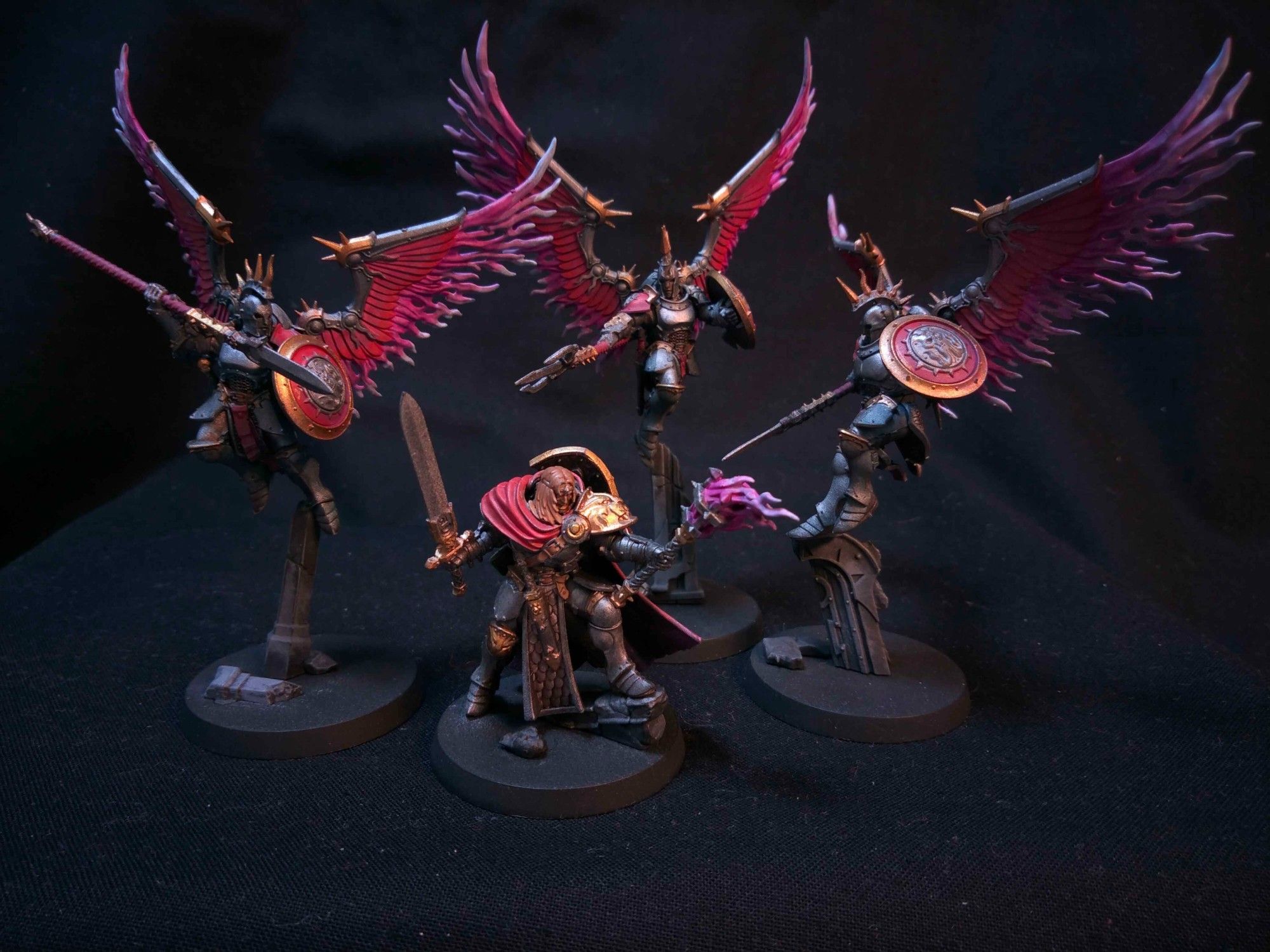 3 winged Prosecutors with red-purple wings and shields, and a Knight-Questor with similiar colours.