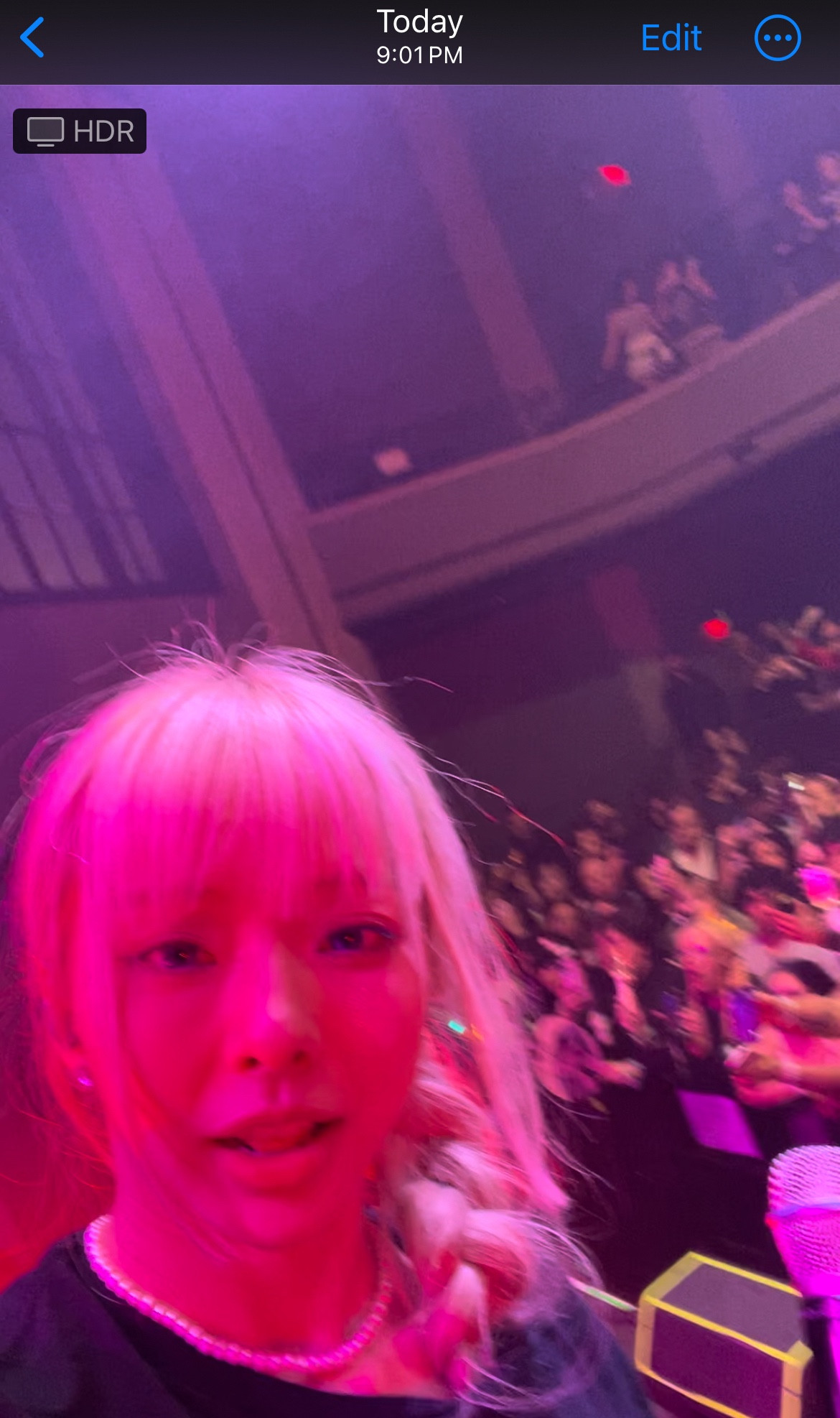 Cutie patootie hongkongese girl with light hair in a braid (Singer and Ace VIVI FROM LOONA) looking at the camera at the Pittsburgh Loossemble tour. Strawberry Soda was playing in the BG.