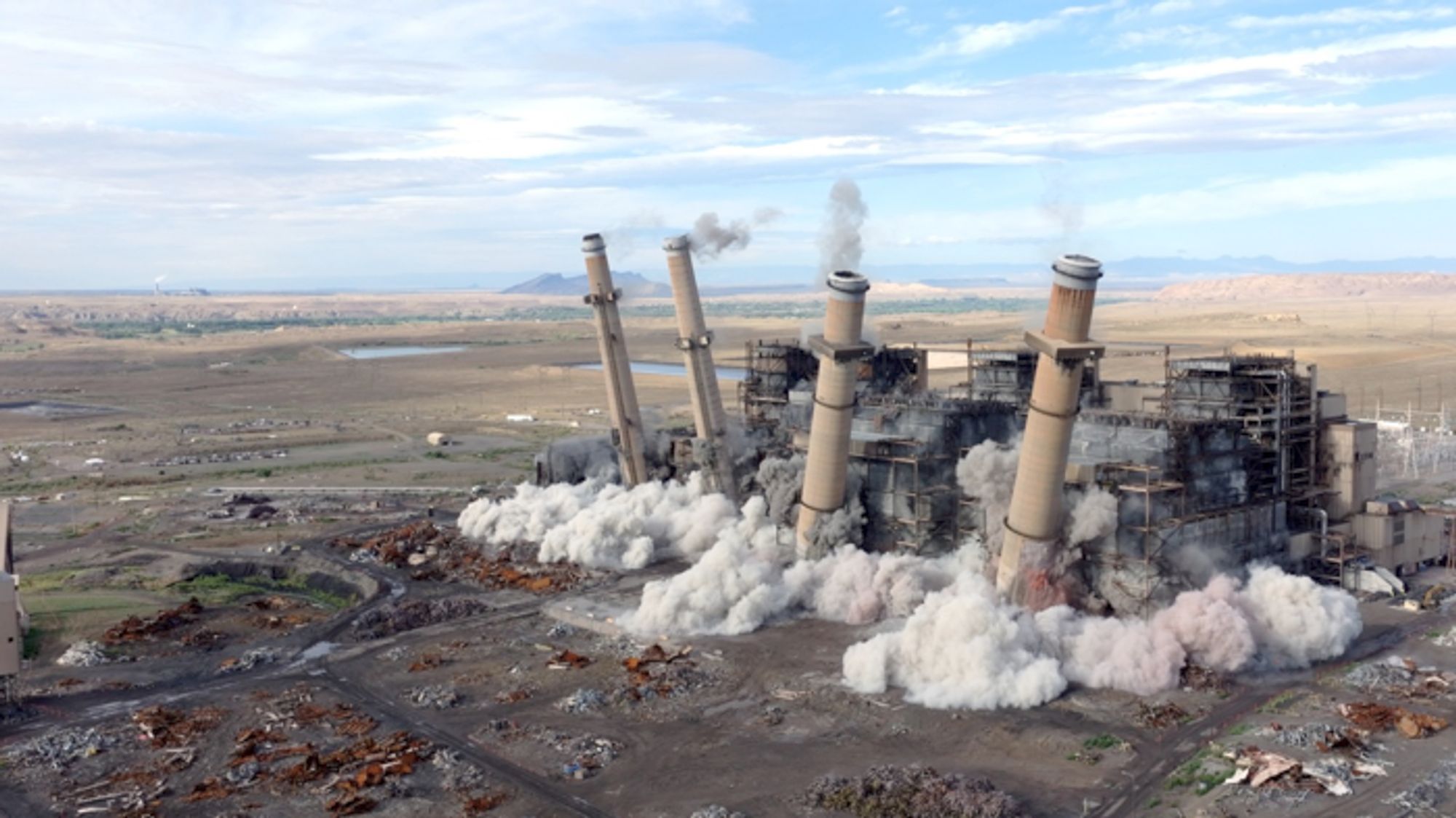 A coal power plant demolition serves as a poignant historical moment for the Navajo