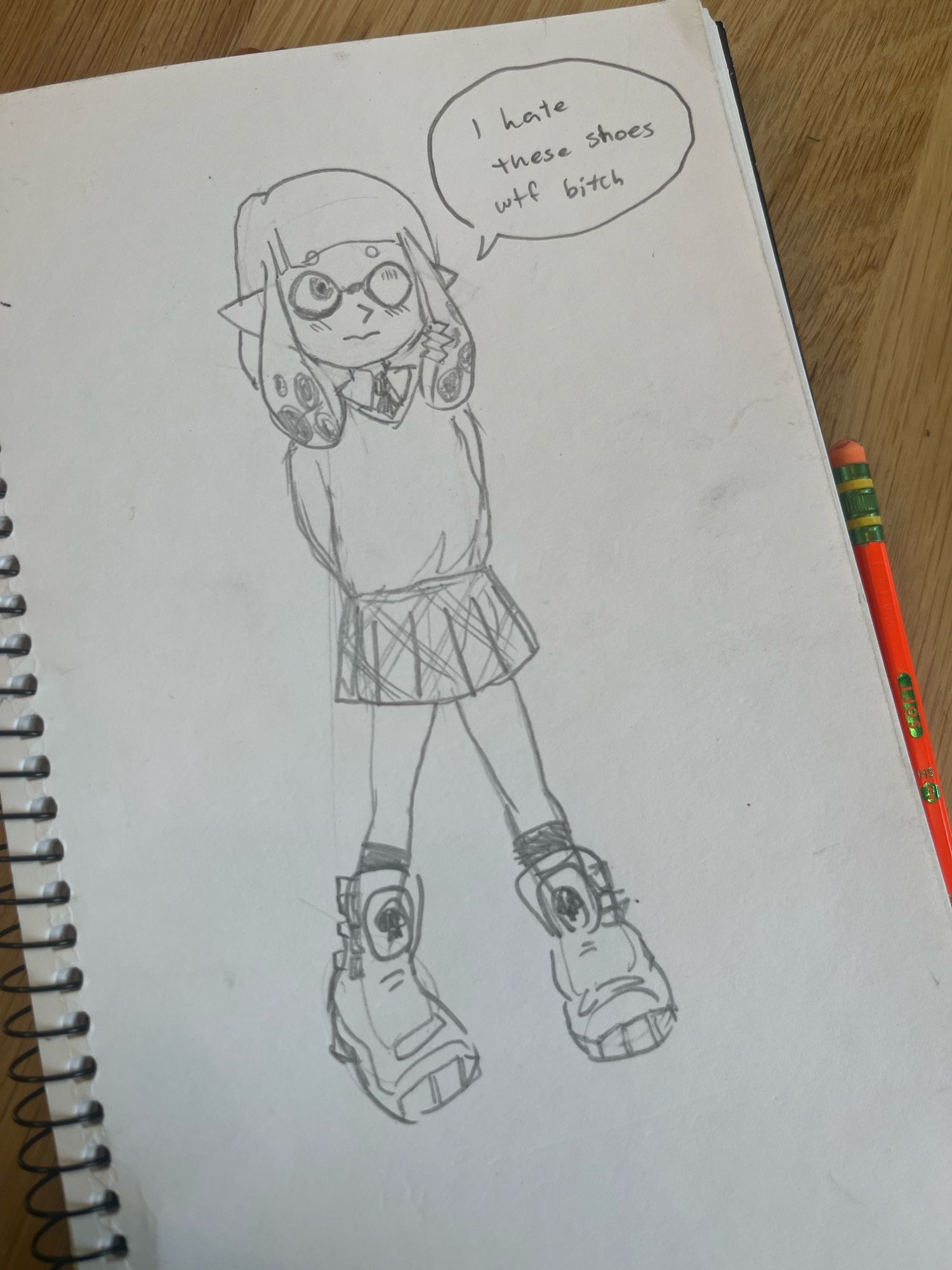 An inkling with a schoolgirl outfit and big shoes. They say “I hate these shoes wtf bitch”