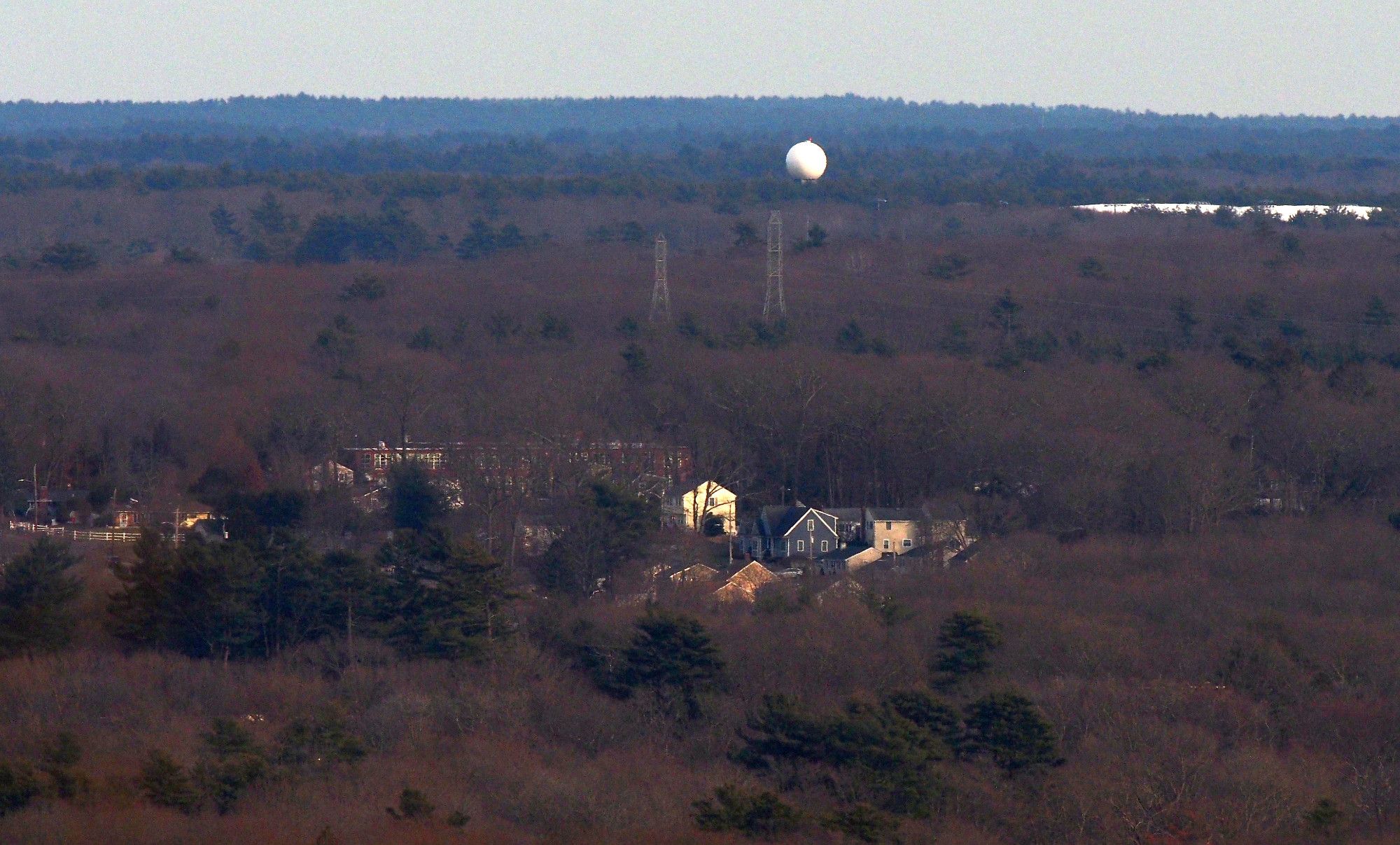 Doppler Radar Tower, Naval Air Station South Weymouth, South Weymouth MA photograped from Buck Hill. This is on the grounds of a large abandoned Navel Air Station. Seems like a cool place to check out. There is an old airport control tower still standing on the site, but unfortunately it is not visible from Buck Hill.

To the right is the large white roof of The Hangout at Union Point, 26 Memorial Grove Ave, Weymouth MA

The lower splash of school and houses near the bottom of the frame is all in Braintree MA. South Middle School, 232 Peach St, Braintree MA. 

Houses I have identified are:

94 and 100 Richard Rd
126, 118 and 92 Celia Rd
119, 111, 95 and 85 Celia Rd
14 and 15 Moreland Rd

#buckhill #bluehills #bluehillsreservation #boston #BostonMA #Weymouth #WeymouthMA #SouthWeymouth #SouthWeymouthMA #Braintree #BraintreeMA #landscape #LandscapePhotography #photography #LongDistanceObservations