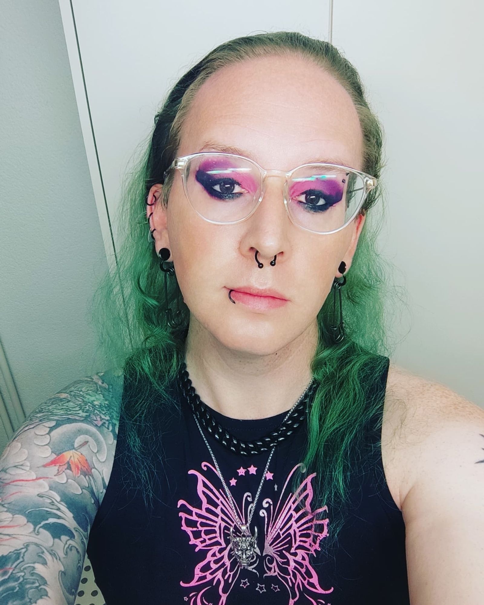 Nyarla showing off its pink to purple Makeup with glasses