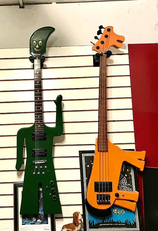 These are two guitars made by Johnson. One looks like Gumby waving, and the other one looks like Pokey, his horse friend. I would pay good money to see a band play these in concert.