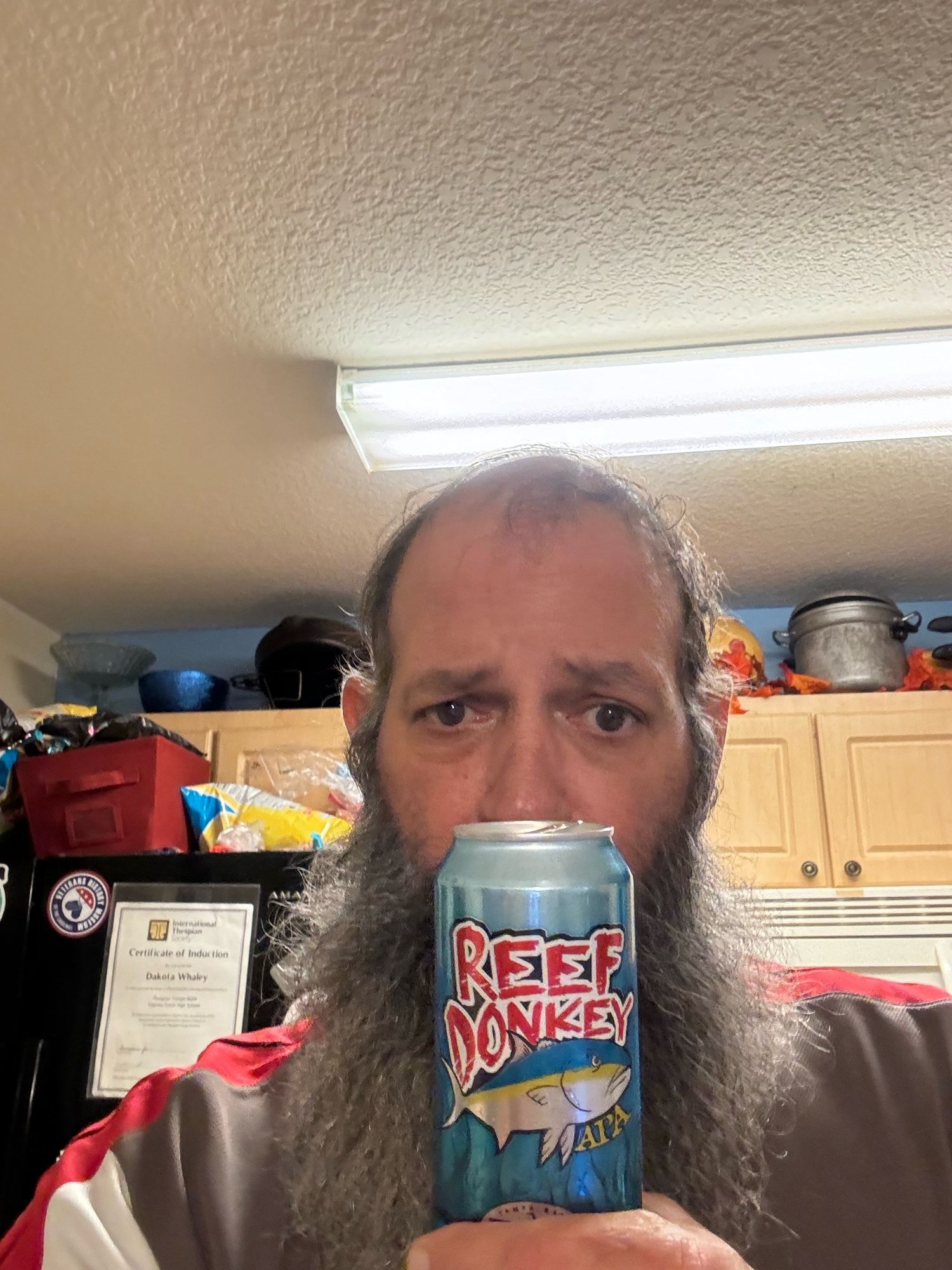 A bearded doofus with a 16oz can of Reef Donkey, an American Pale Ale by Tampa Bay Brewing Company.