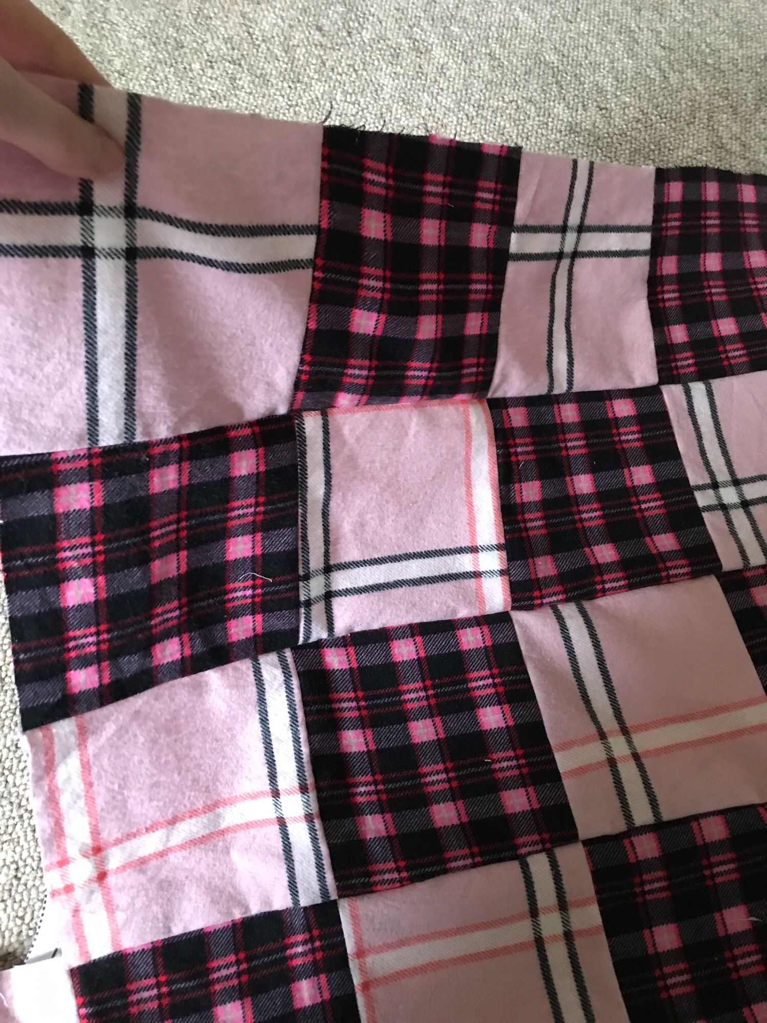 Light and dark pink checked tartan fabric