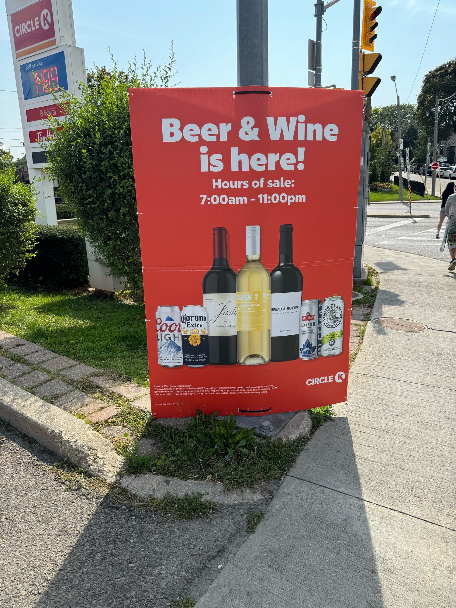 A poster at a local gas station advertising beer and alcohol sales.