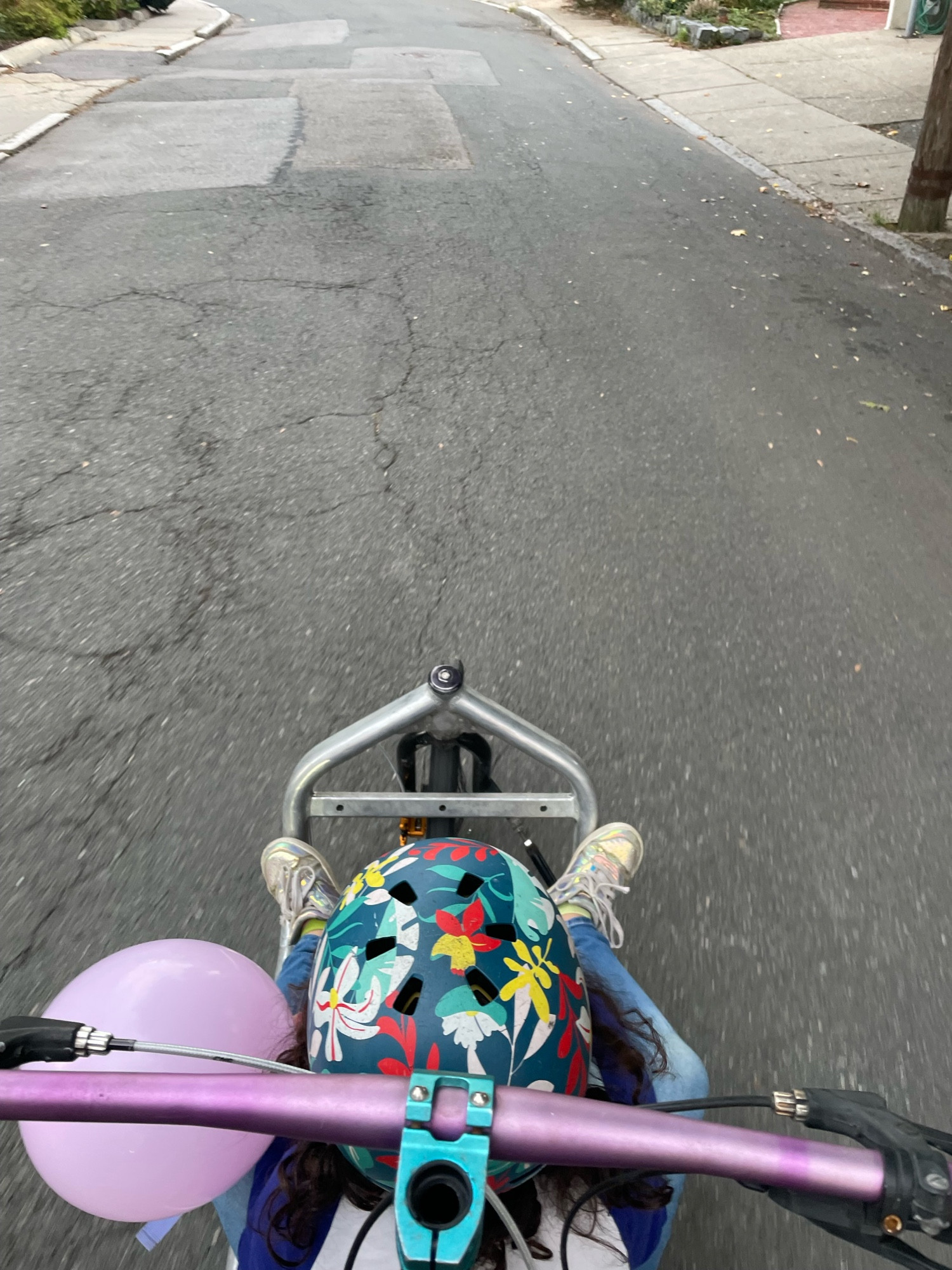 A kid sitting on the floor of a Bullitt cargobike