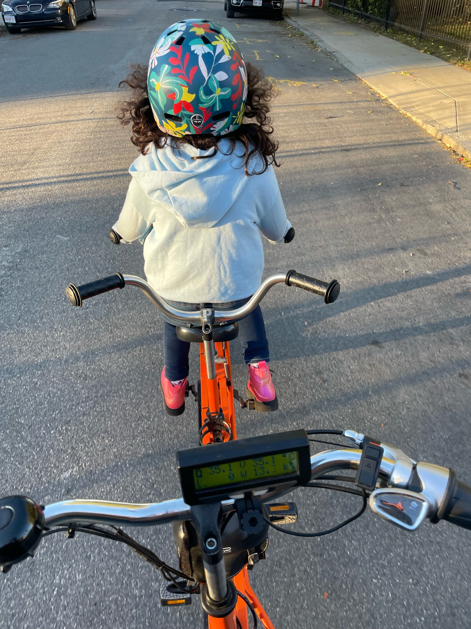 A kid riding in the front of a kids tandem 