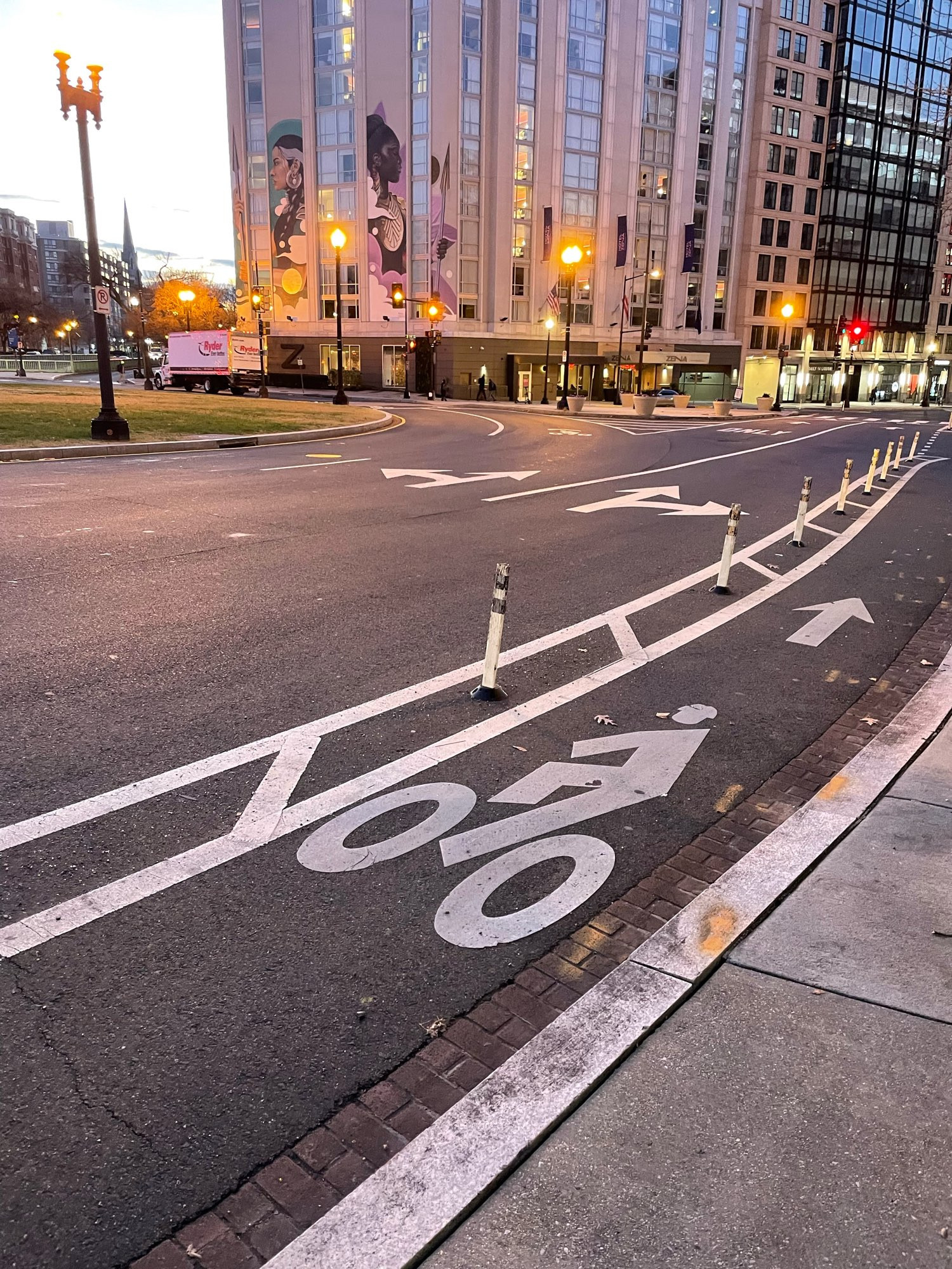 A flexpost delineated bike lane in a three lane traffic circle