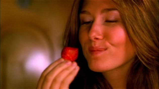 Kaylee Frye eating a strawberry.