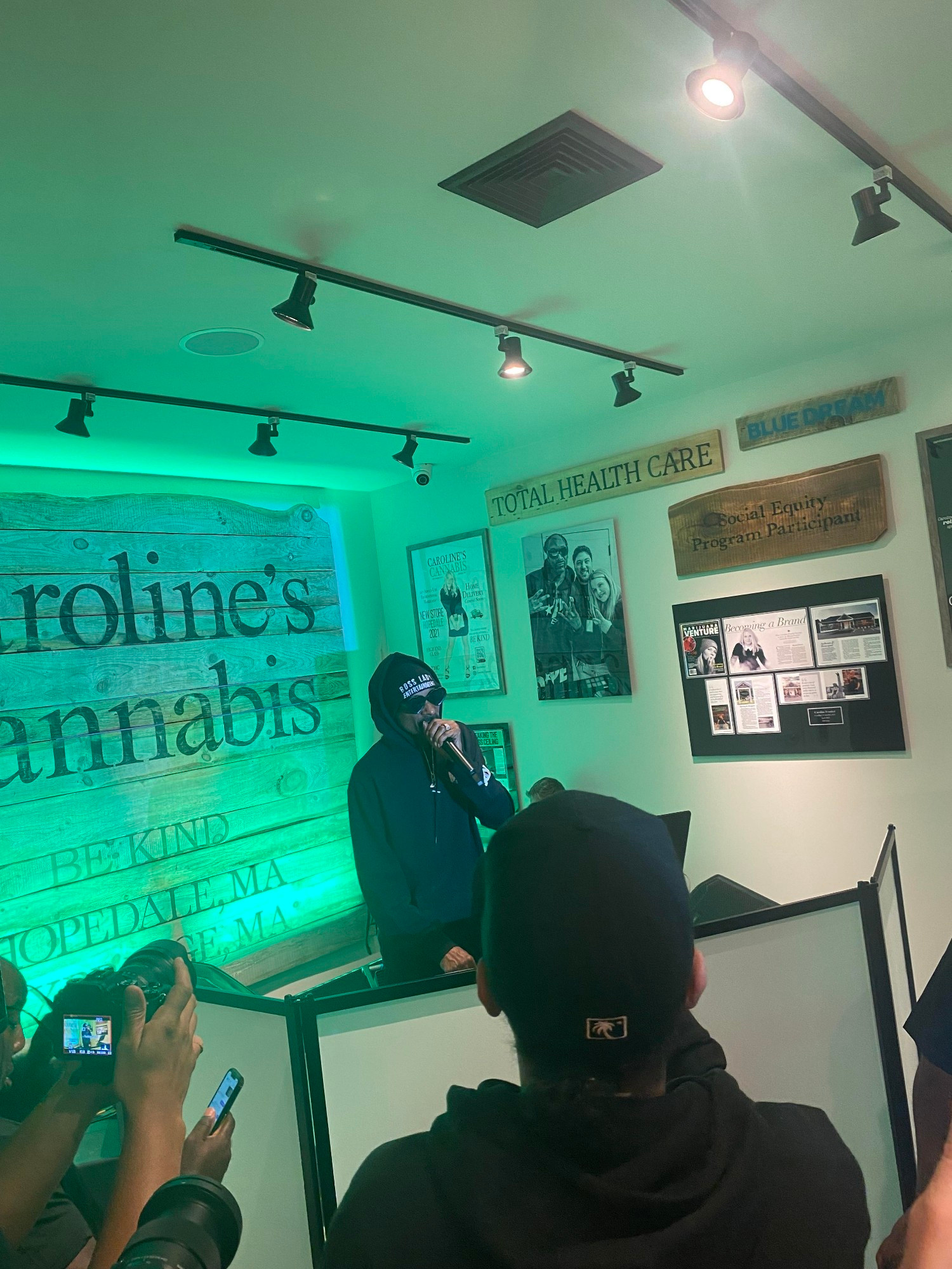 Snoop Dogg talking into a microphone at Caroline's Cannabis in Hopedale, MA