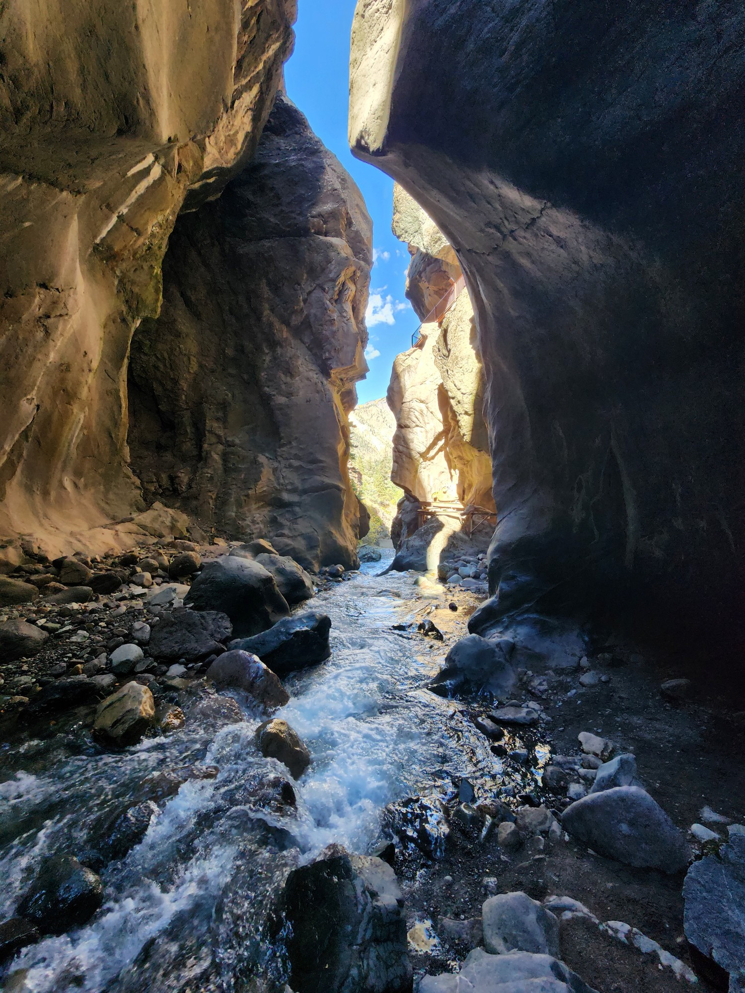 A picture of a view of a river in a deep box canyon