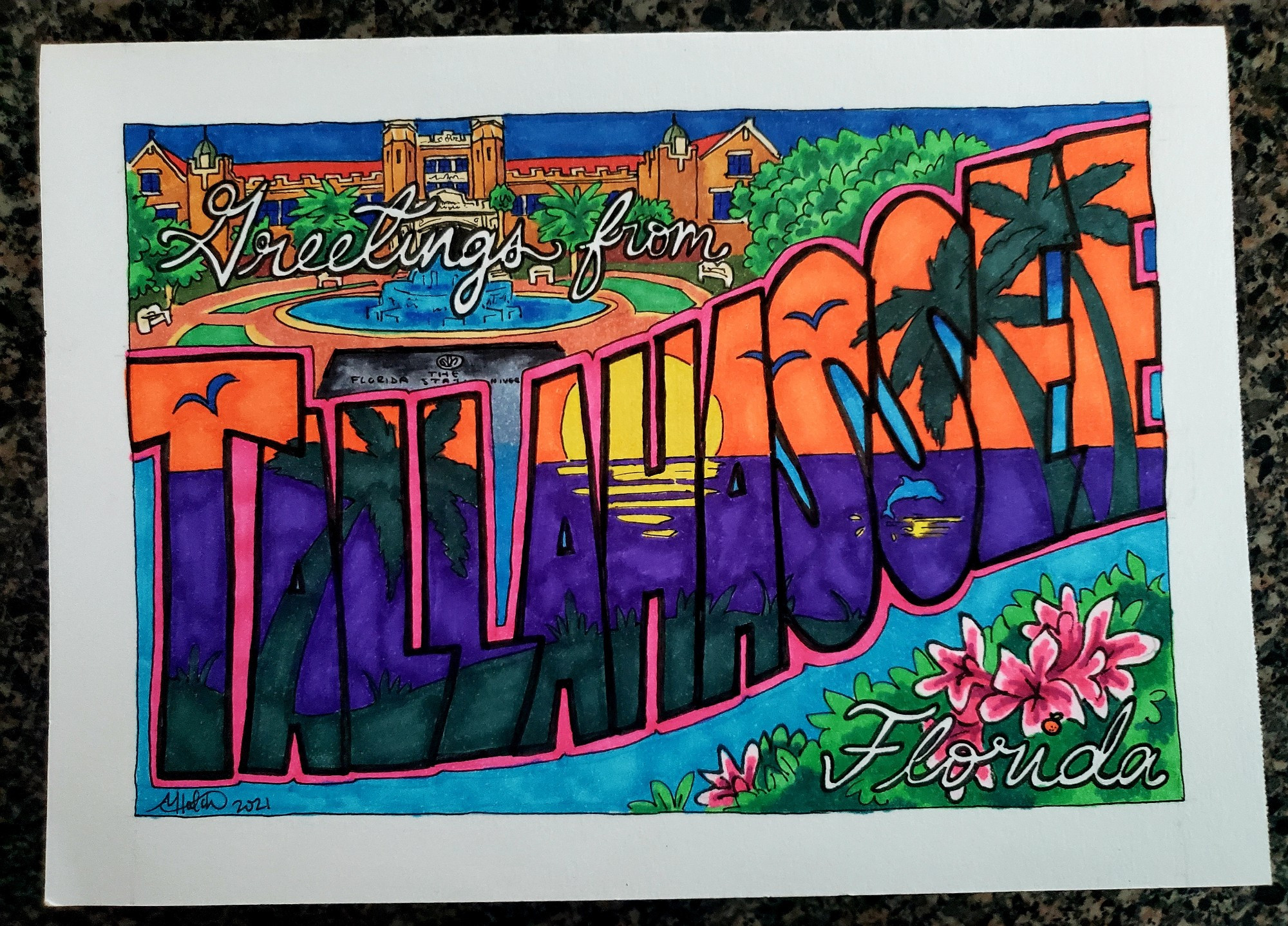 handmade postcard that says Greetings from Tallahassee, Florida. TALLAHASSEE is in bold lettering that features a picture of a sunset inside it  surrounding the "Greetings from" features Ruby Diamond Building from FSU, and an azalea bush is featured behind the word Florida