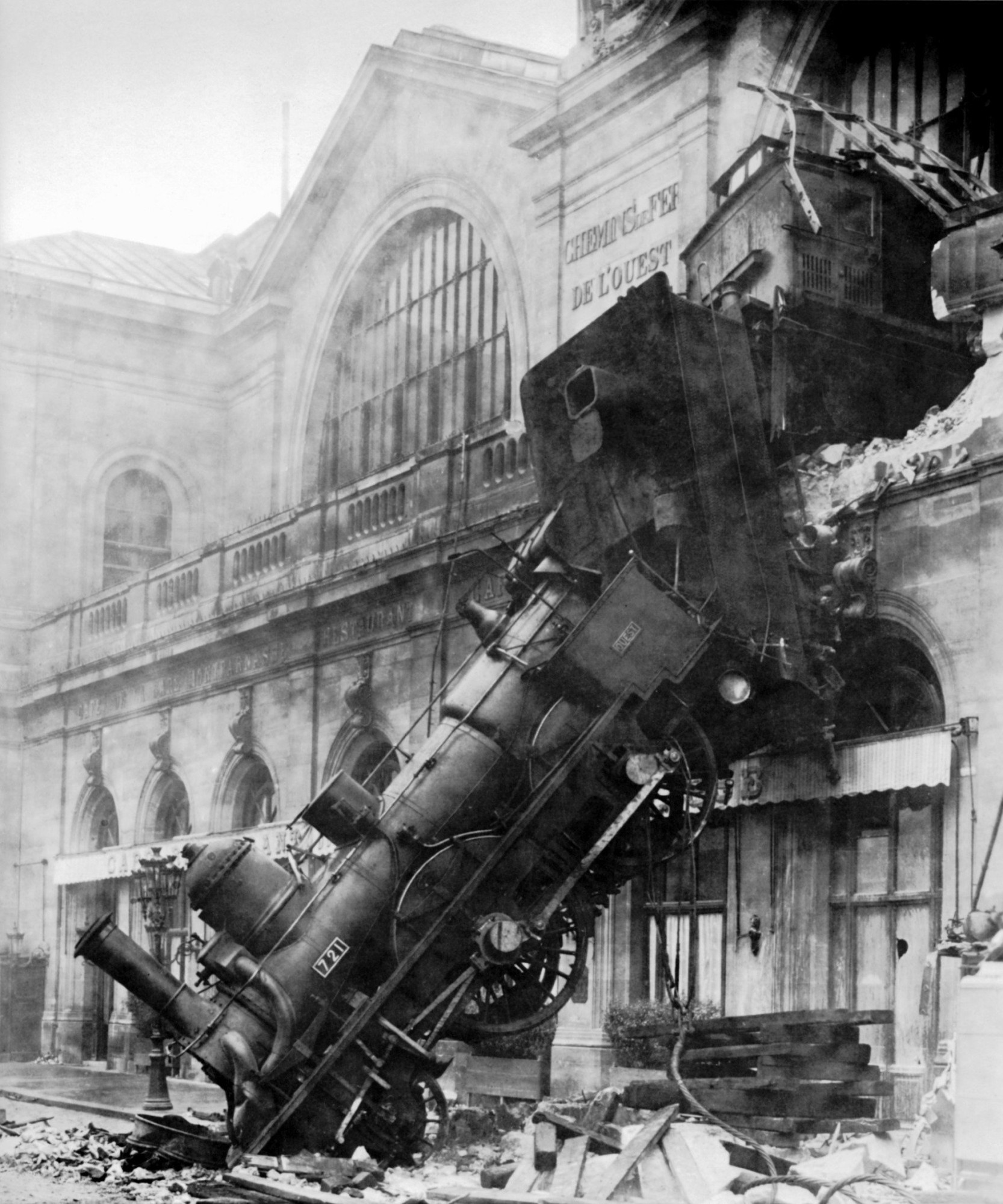 Train breaks out of the station and on to the street in Montparnasse back in the day.