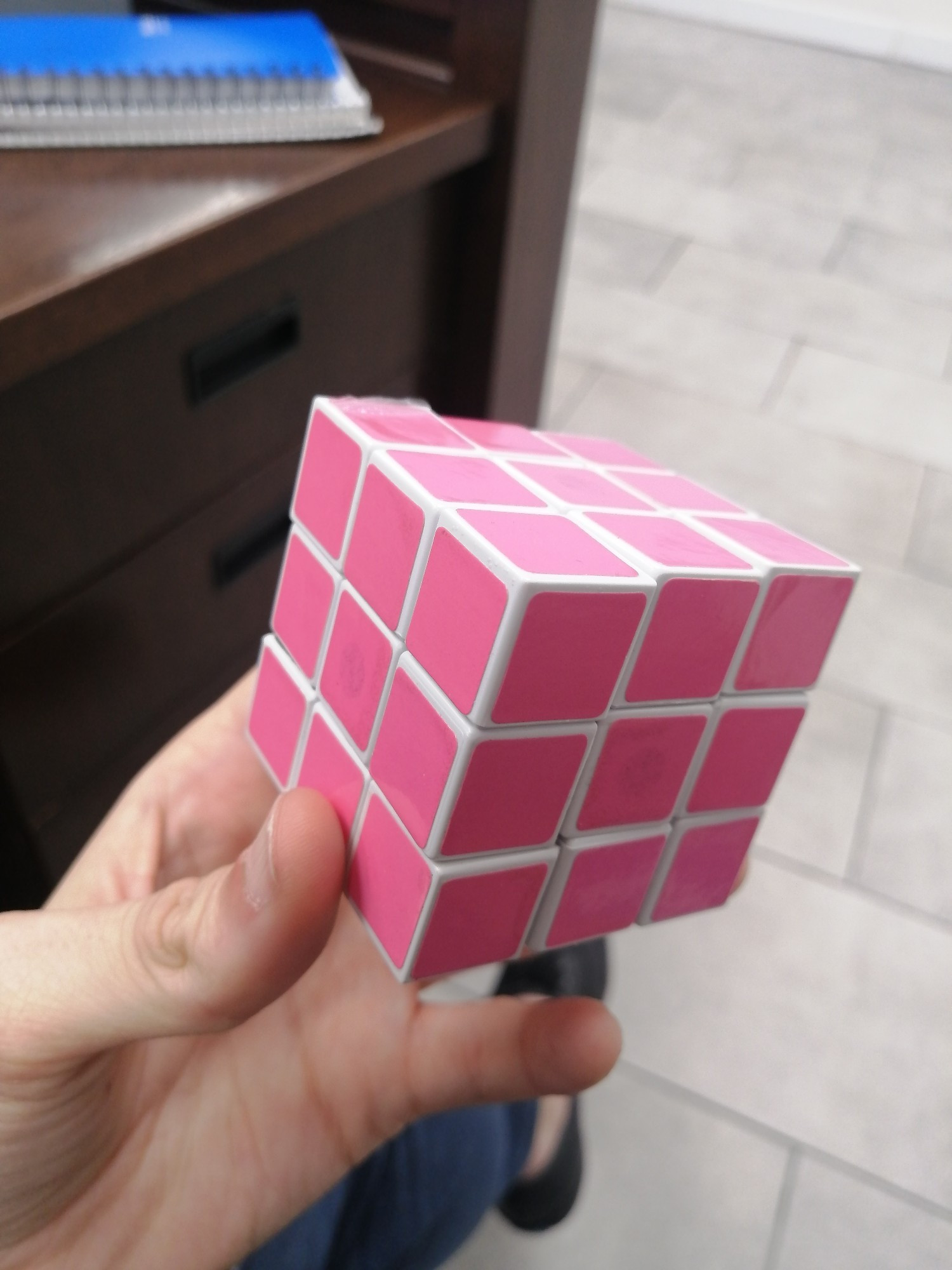 Picture of a Rubik cube but all the sides are pink and pink only