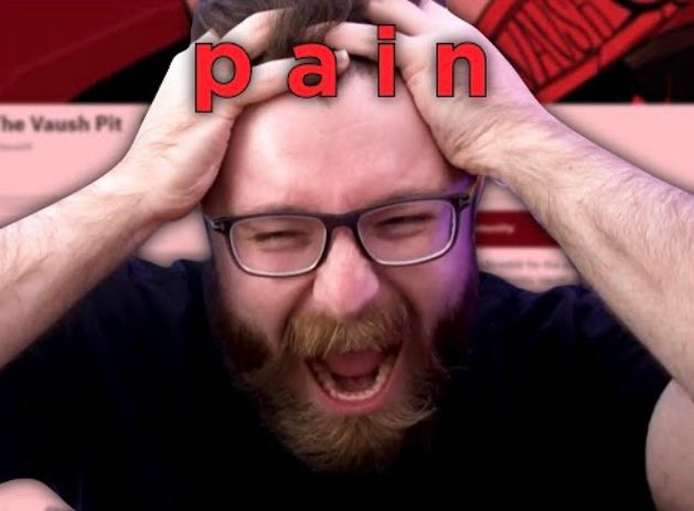 pain written in red while vowsh holds his head screaming in agony