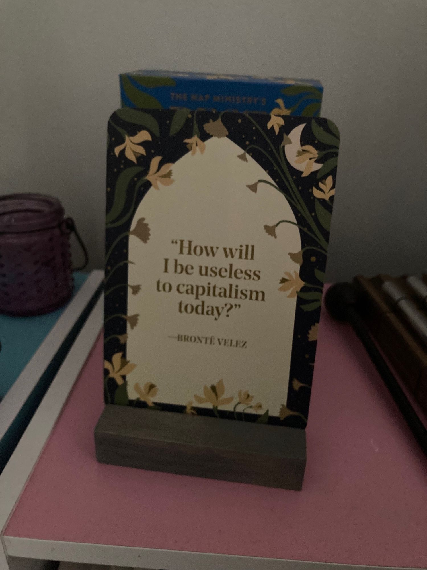 Card showing the text, “How will I be useless to capitalism today?”