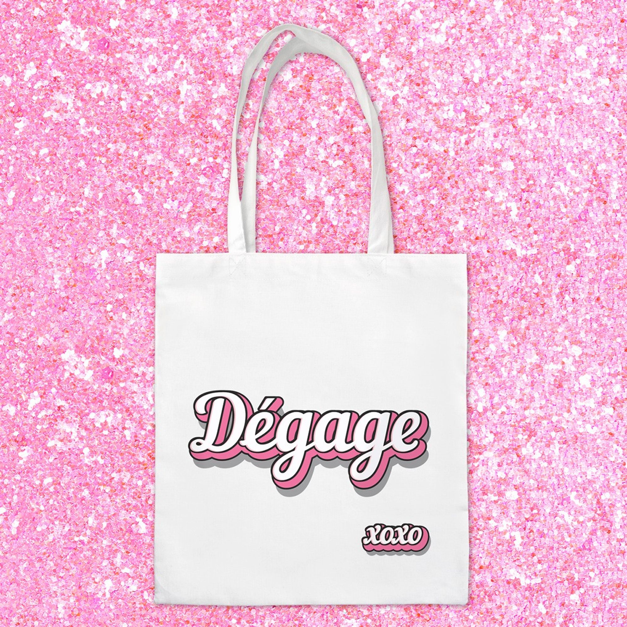 Tote bag 100% coton avec le texte blanc et rose "Dégage" imprimé, idéal pour faire passer un message quand vous êtes de mauvaise humeur !