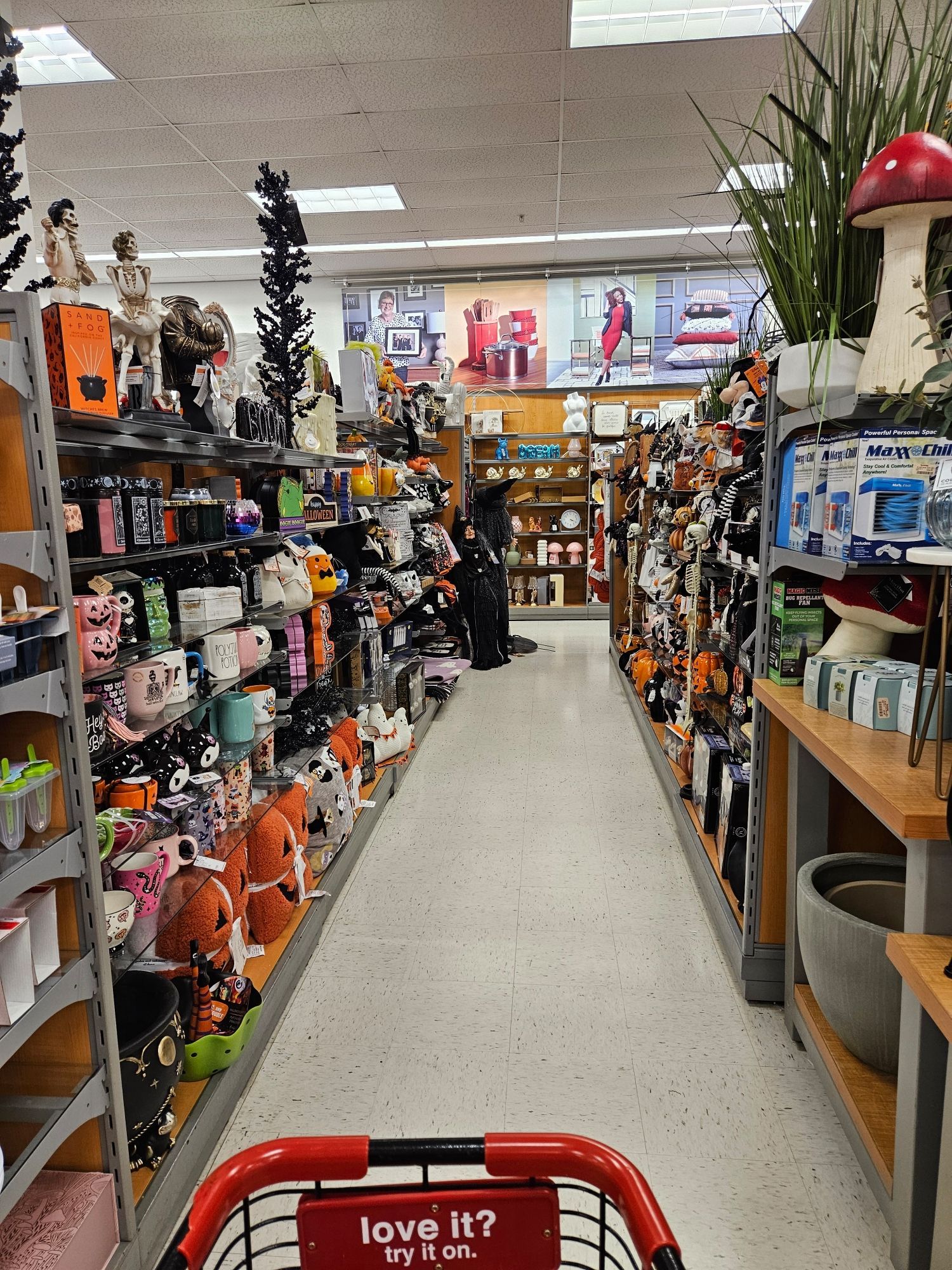 Image is an aisle at TJ Maxx full of Halloween decor