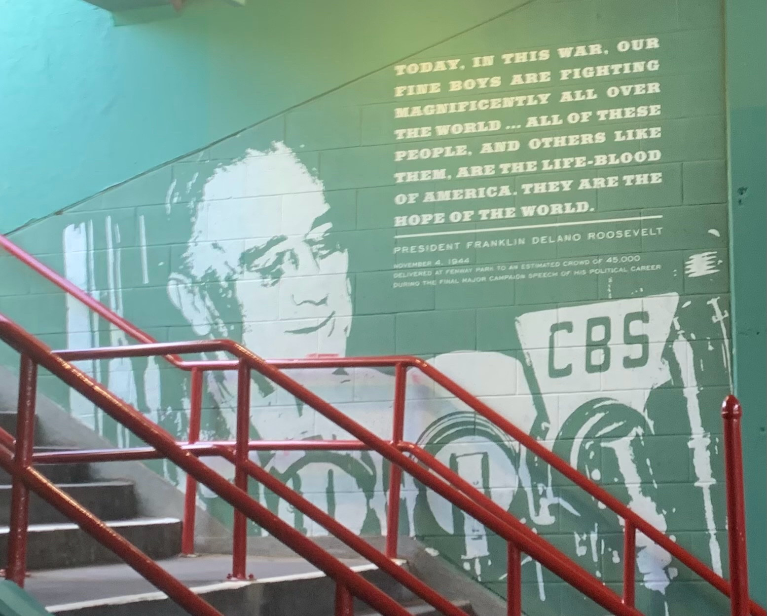 A mural showing FDR and quoting a speech he gave at Fenway in 1944 praising the people currently fighting overseas for the country.