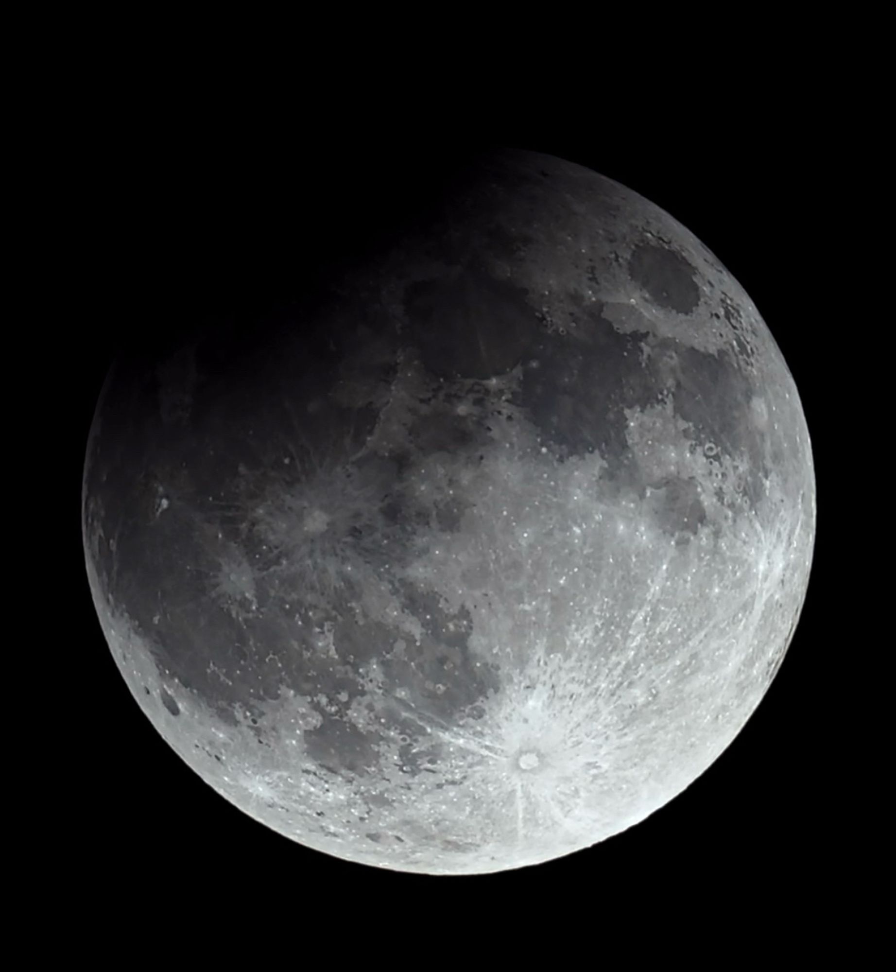 The full moon with about 3% of the top left corner eclipsed during the partial eclipse/penumbral eclipse on 9/17/24