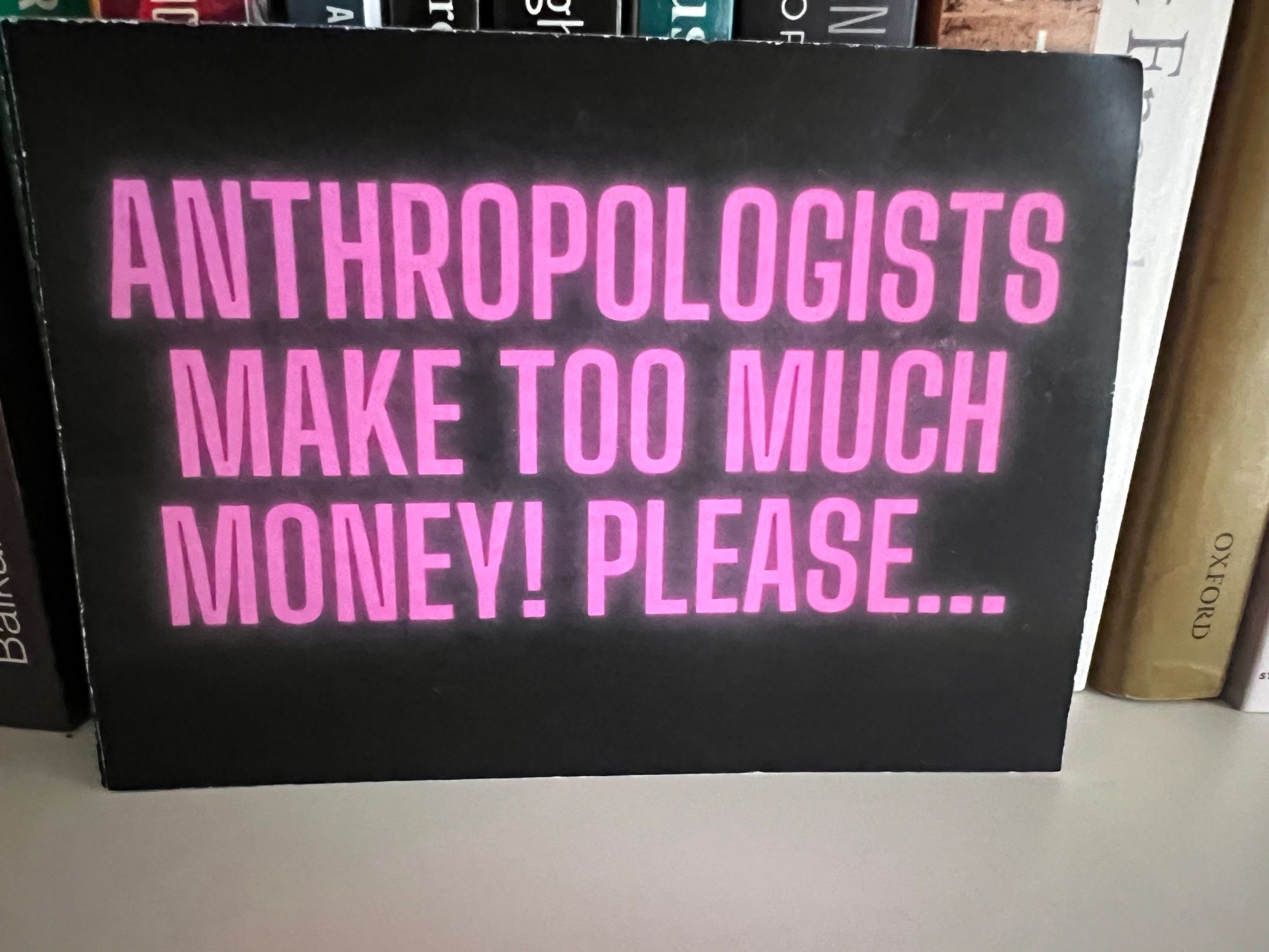 A postcard that reads: anthropologists make too much money. Please…