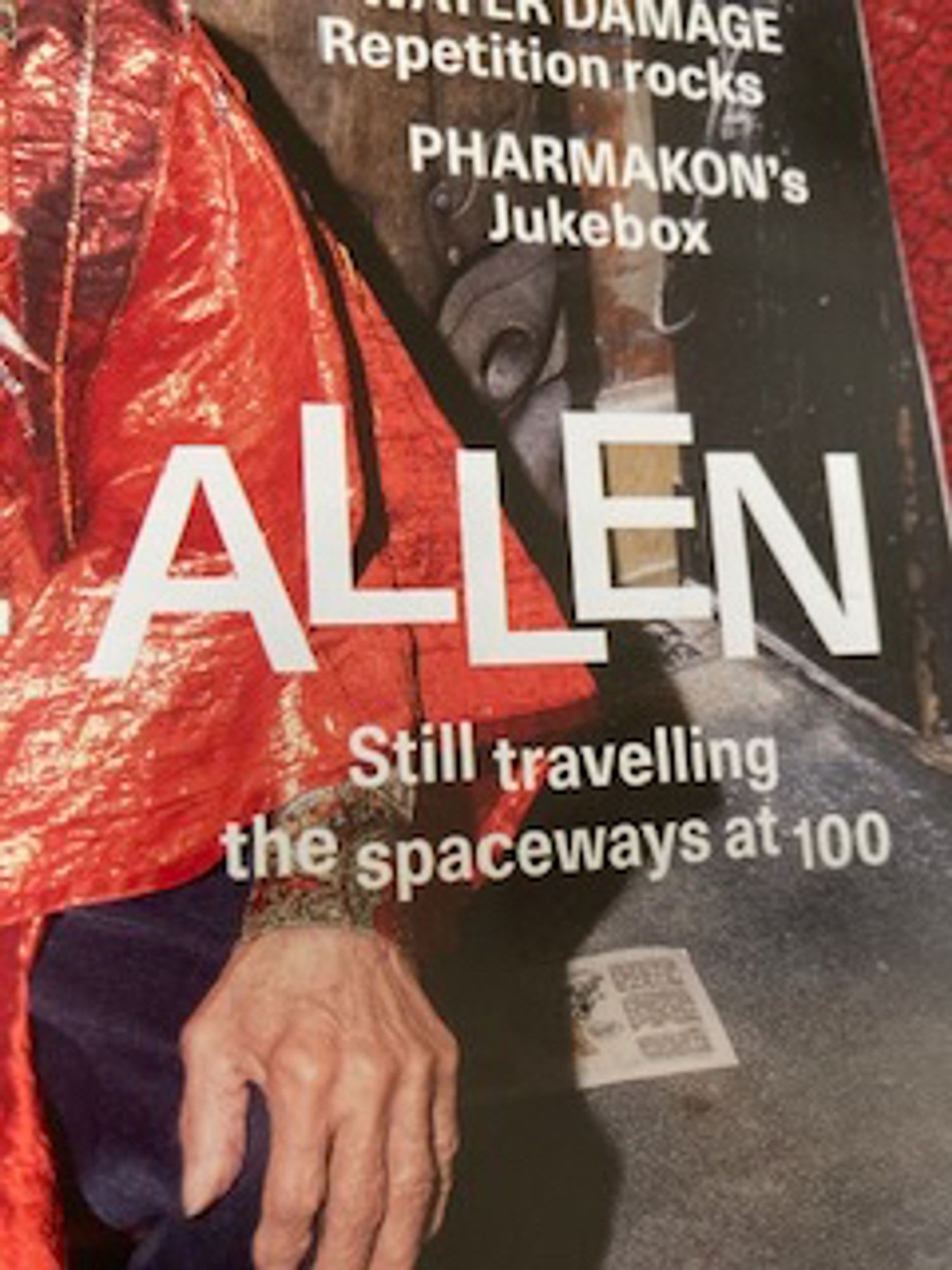 a close-up of marshall allen's hand and his orange sleeve on the cover of the wire, plus some coverlines: “WATER DAMAGE Repetition rocks“ and “Pharmakon's Jukebox” -- and then “ALLEN Still travelling the spaceways at 100" in jiggled letter and words.