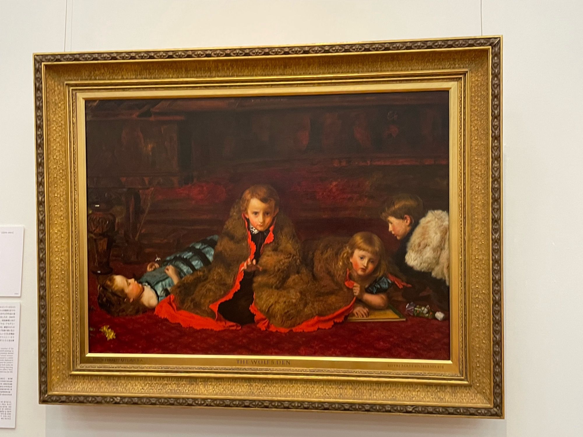 The Wolf’s Den. Four children wrapped up in red silk lined furs with one boy giving his best blue steel to the painter and frankly looking FABULOUS