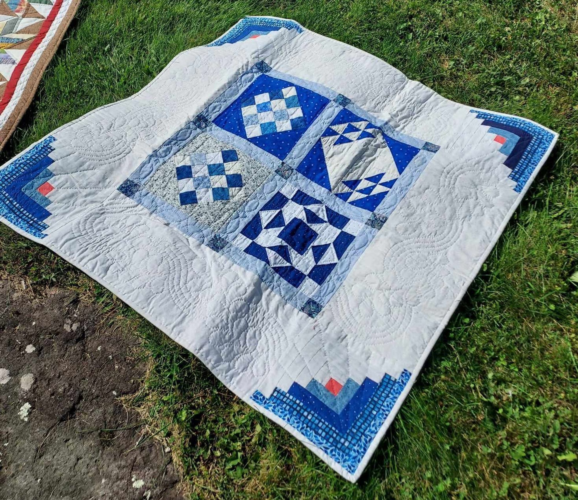 a  blue and white geometric quilt