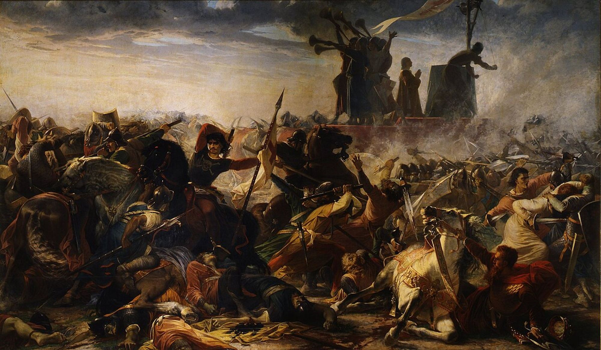 a painting, it is a horrific war scene, smoke over many figures killing and dying, men and horses trampled, a carroccio in the near background, a man praying on it and figures in robes blowing trumpet horns