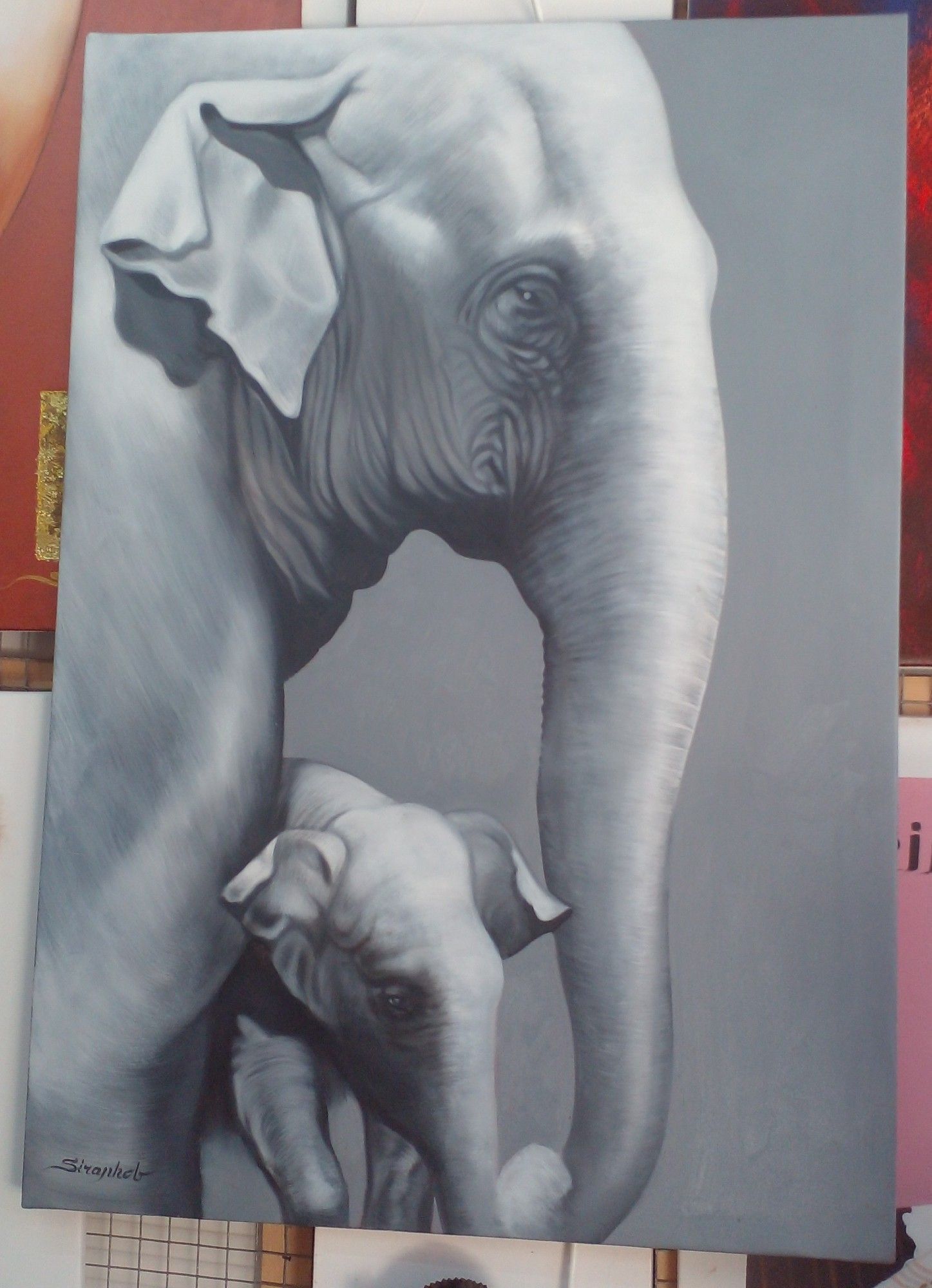 a painting of the front ends of an asian elephant mother and child, her trunk in front of her baby, guarding it