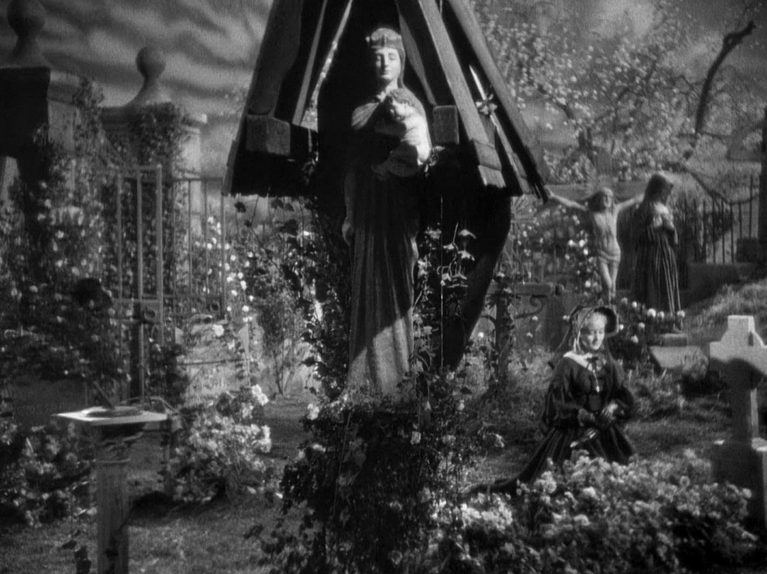 an image of a garden area with cemetery, statues and stone markers in it 