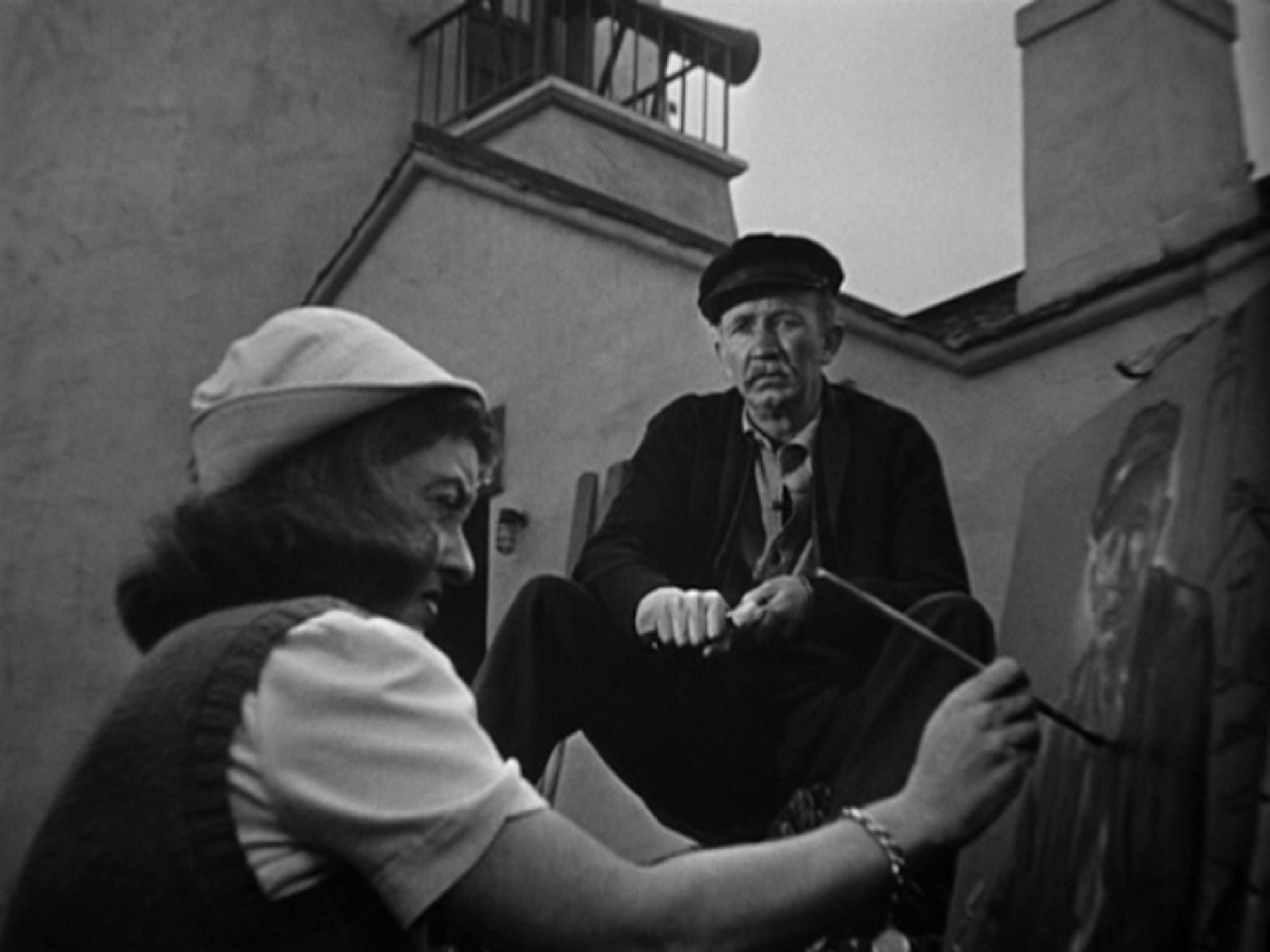 an image from the movie, bette davis is painting a portrait of the lighthouse keeper