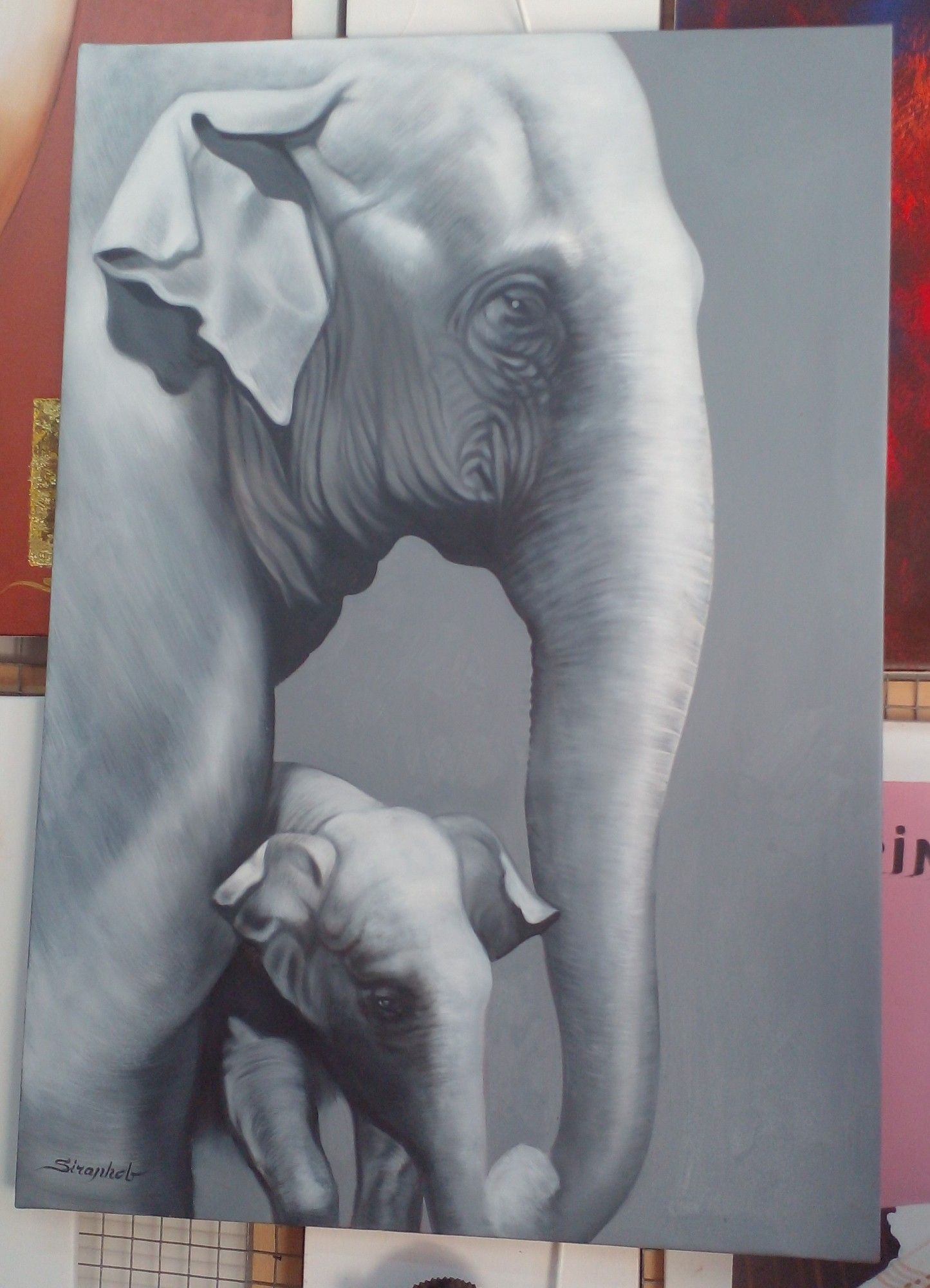 a painting, it is a mother and child elephant, their front ends showing, a tall vertical painting, they are coming in from the left, the mother holding her trunk over her baby, guarding it