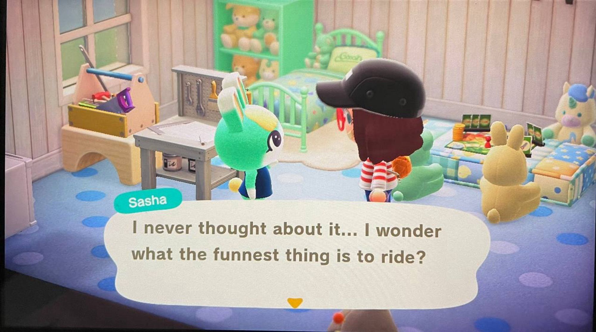 A screenshot of me playing animal crossing. My villager is chatting with Sasha, and there is a dialogue box saying "I never thought about it... I wonder what the funnest thing is to ride?"